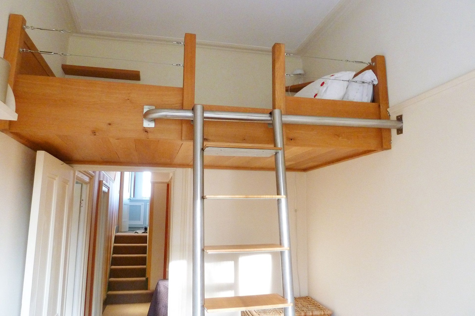 The loft bed is accessable via a ladder