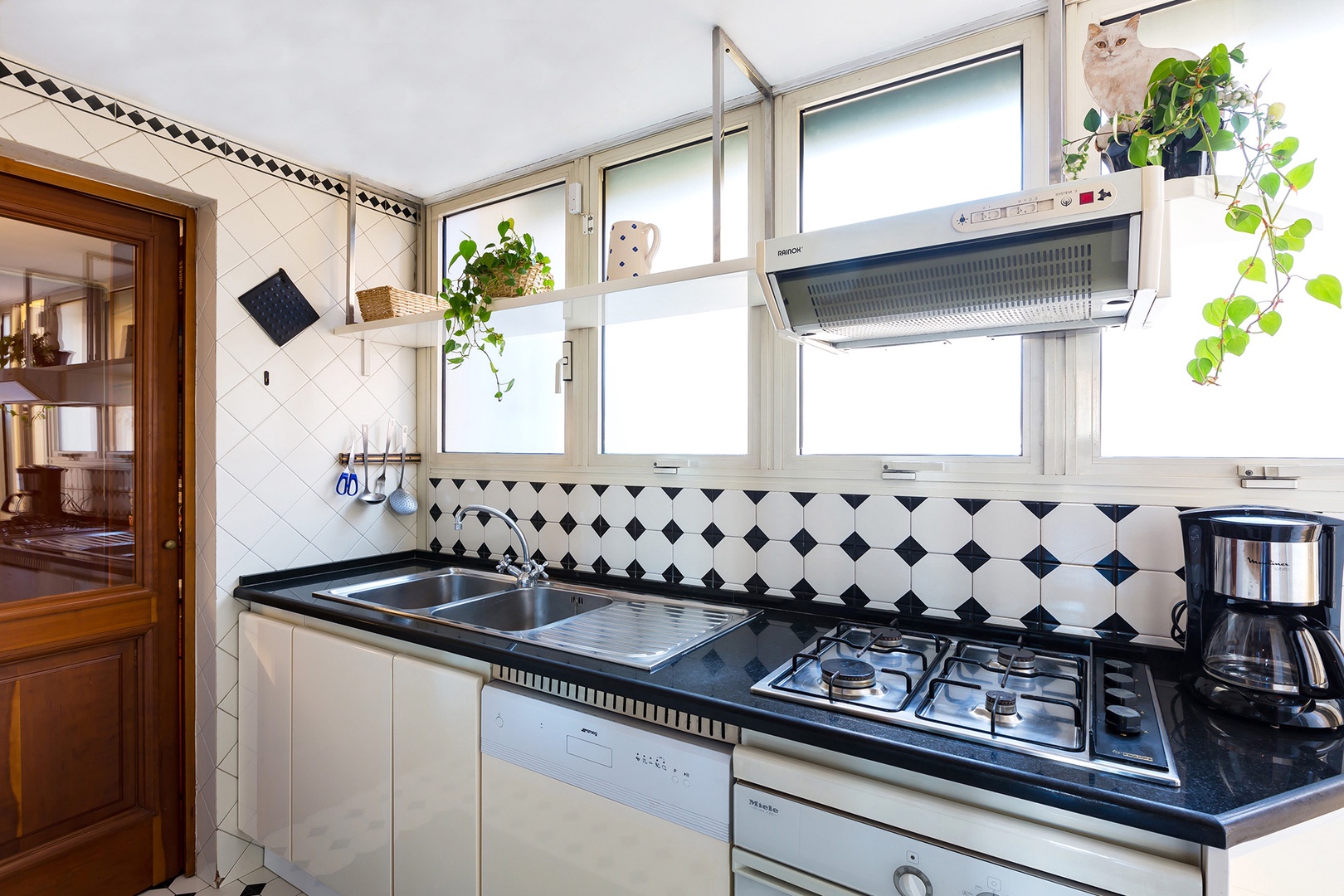 Kitchen is bright and will appointed. It is compact, typical for Italian homes.
