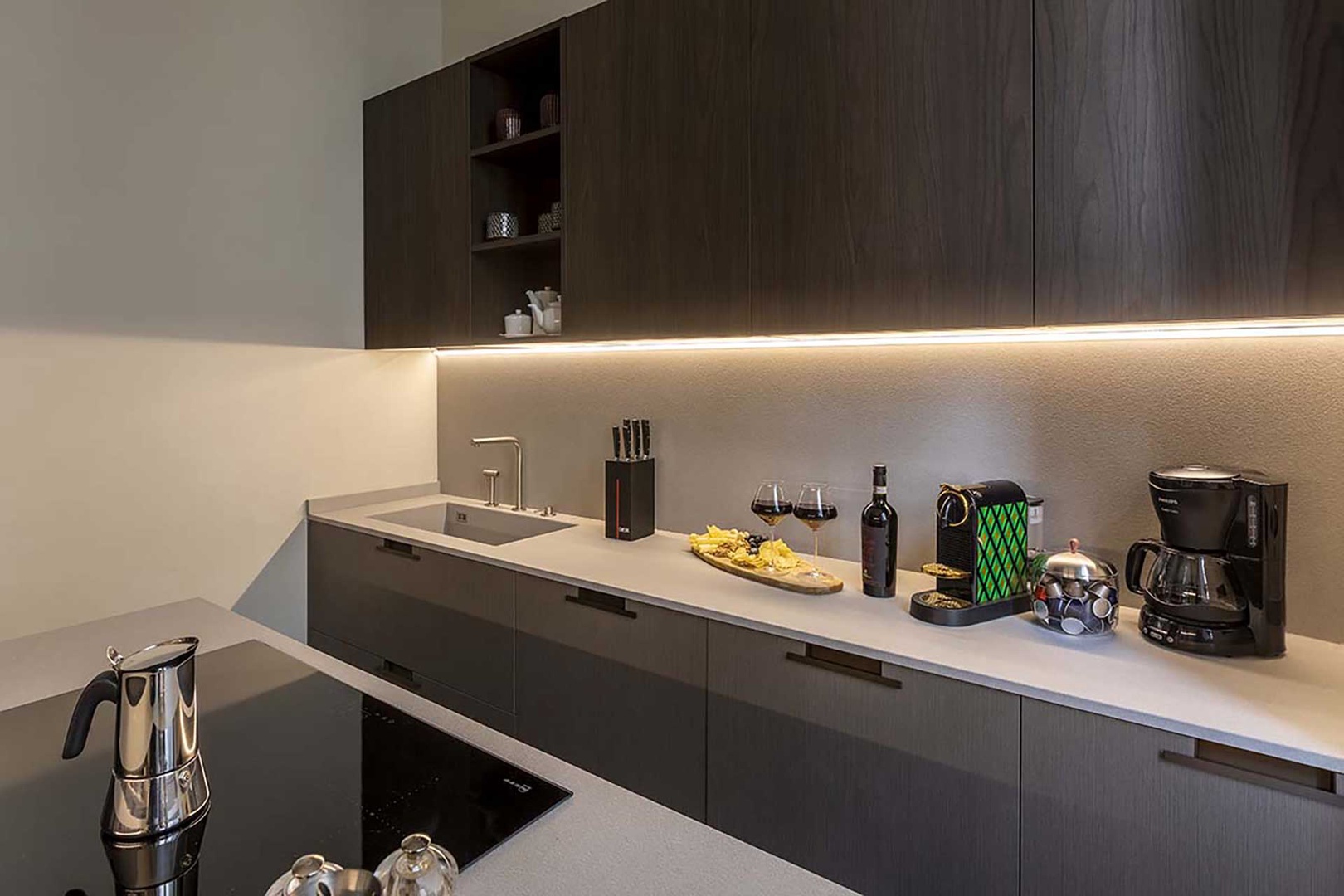 Modern and well designed kitchen perfecting for preparing meals.