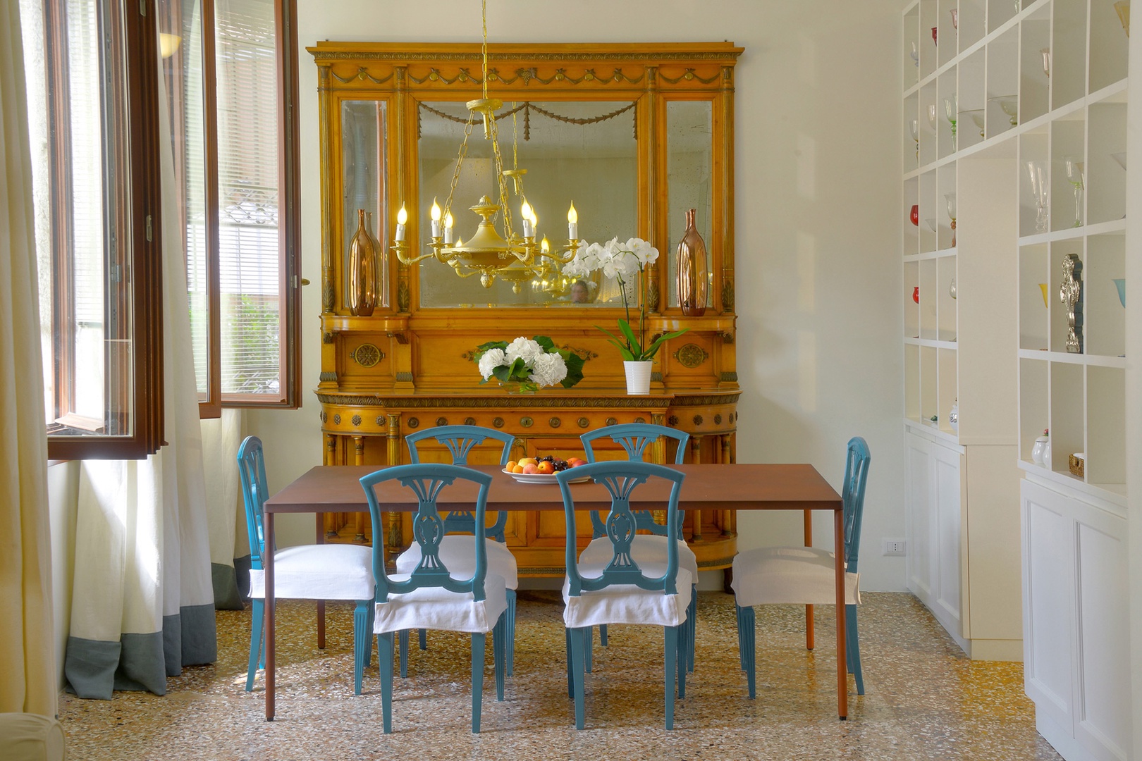 The dining room adjoins the living room with a gorgeous antique sideboard.