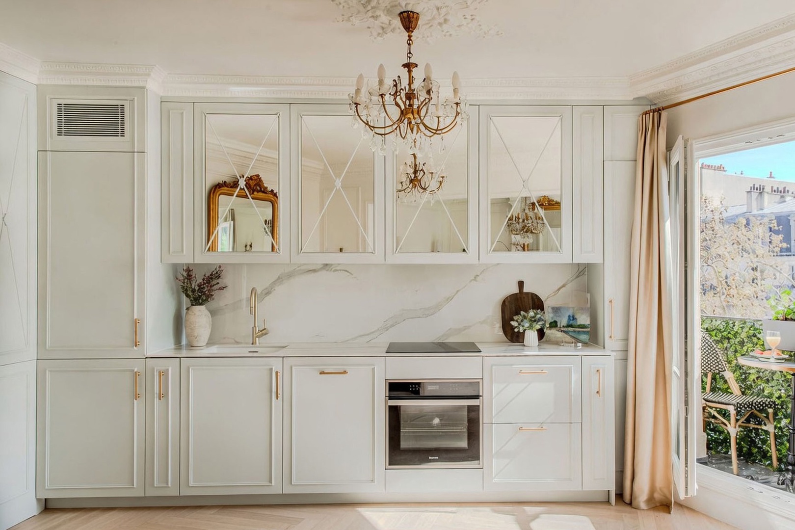 Open plan living room has fully equipped kitchen.