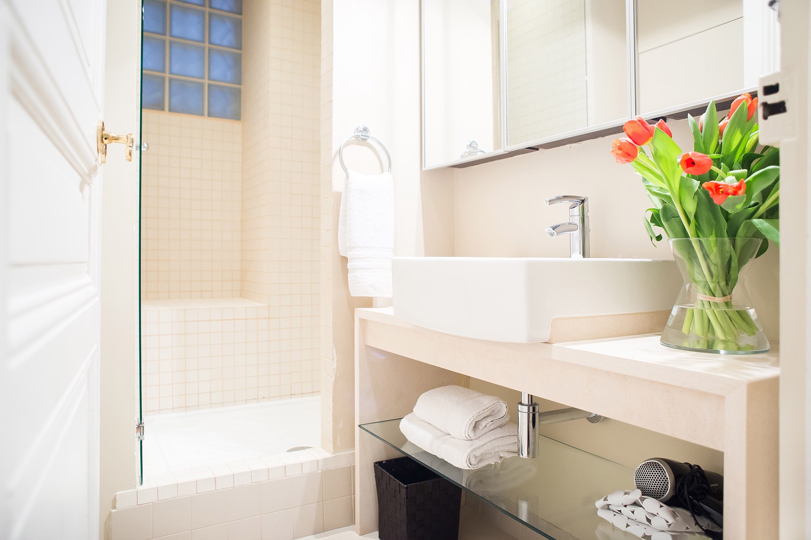 The lovely bathroom 1 has a tiled shower and sink.