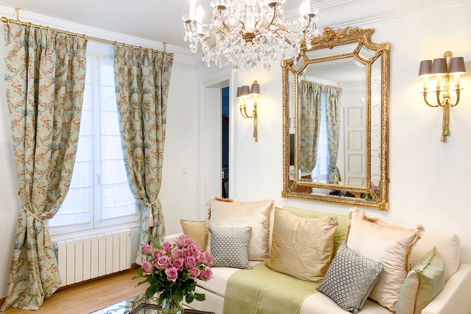 This bright and inviting apartment features two well-designed open-plan living areas.