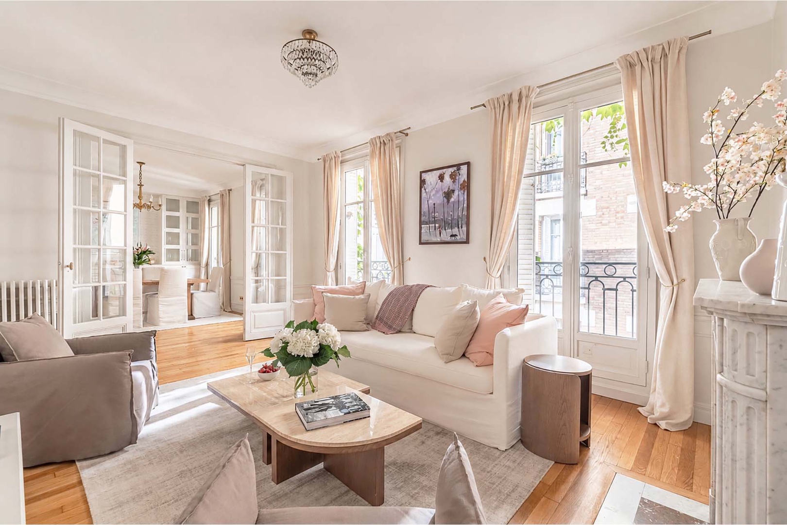 Three sets of large French doors in the living room and dining area.