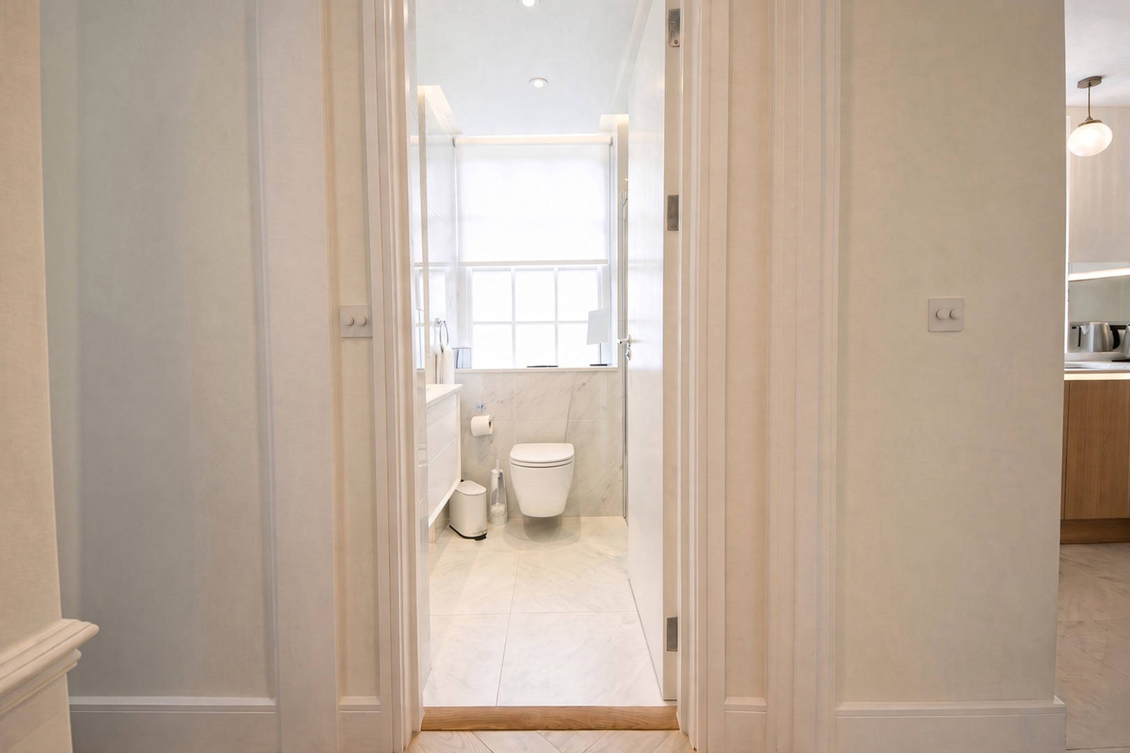 Light-filled bathroom located near bedrooms.