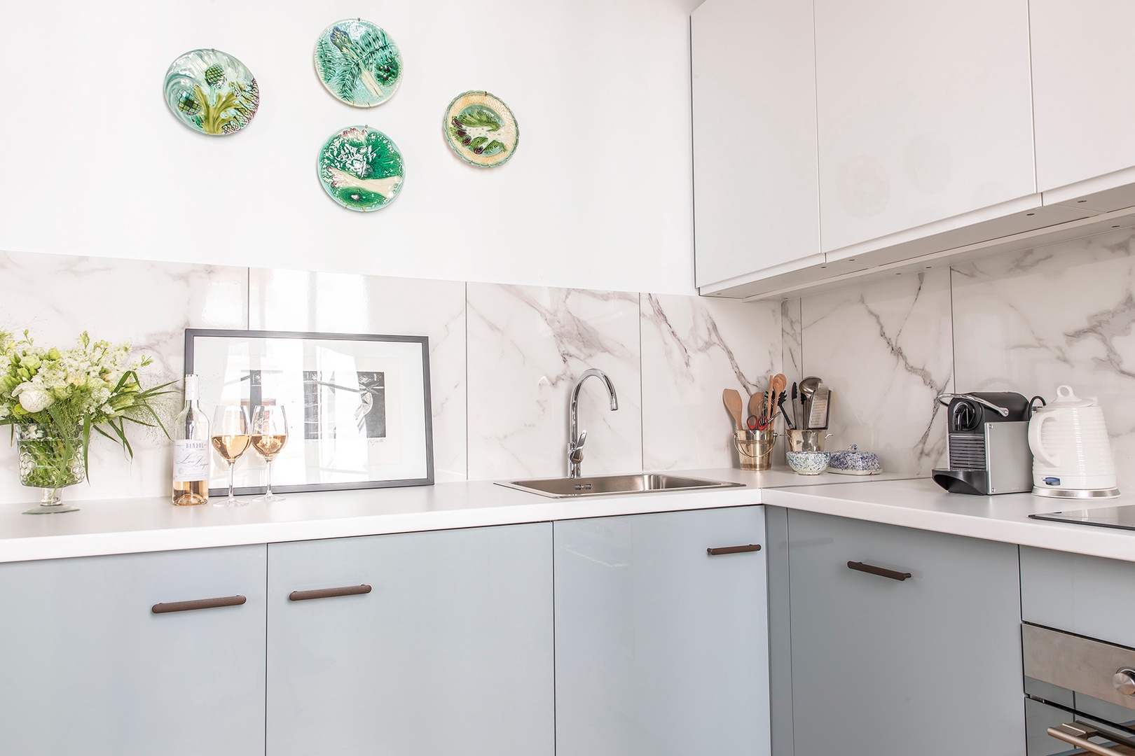 Kitchen is fully equipped for cooking at home.