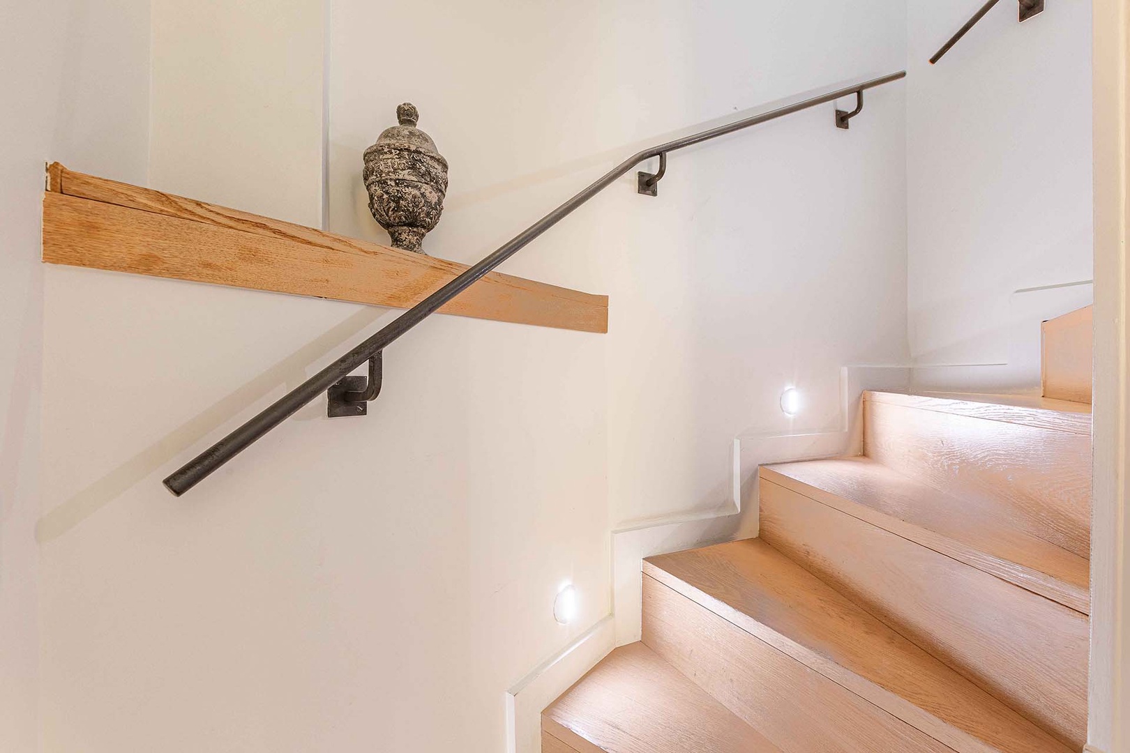 Internal stairs connect the two apartment levels.