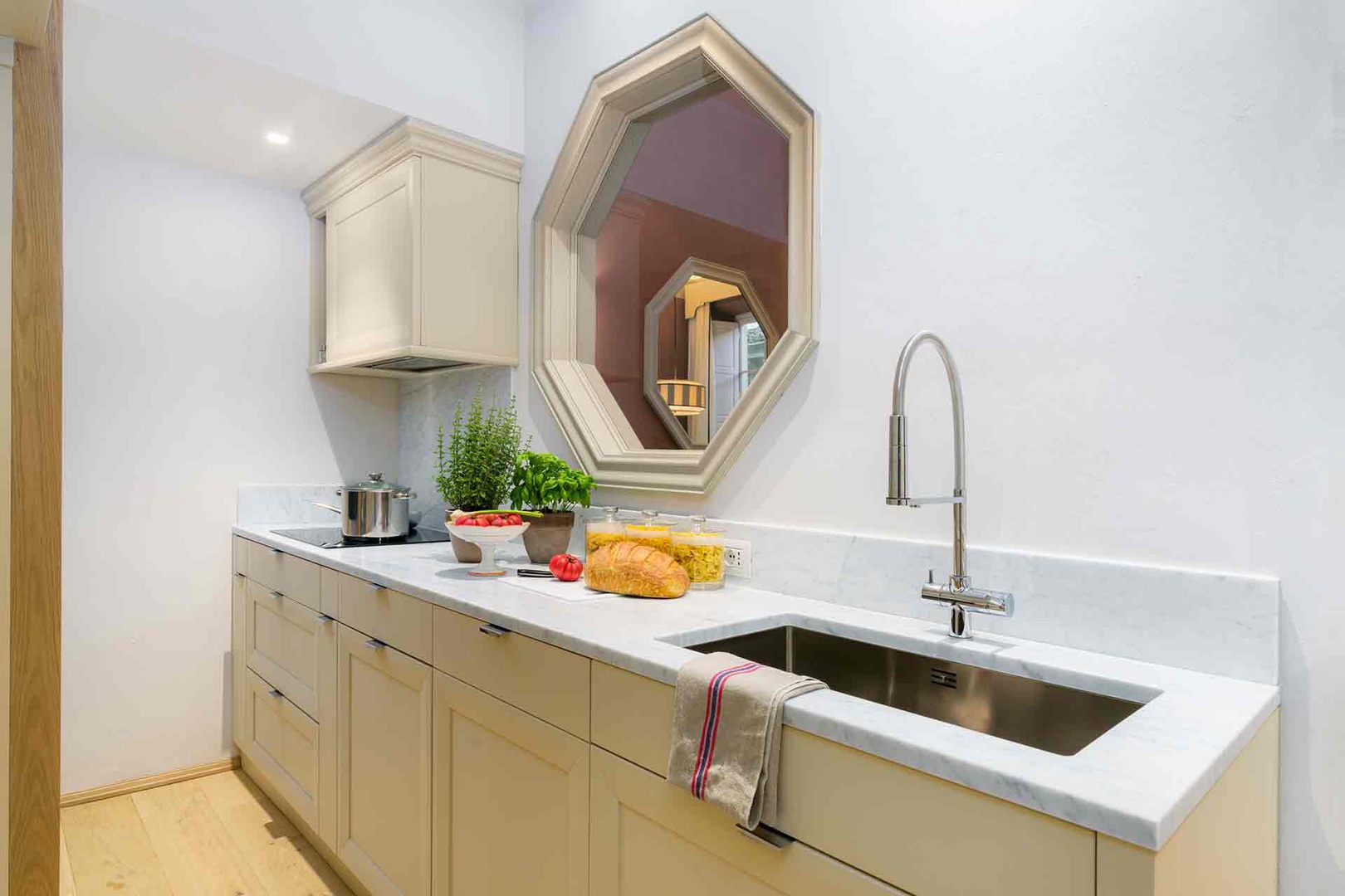 Your sleek modern kitchen features pristine white countertops.