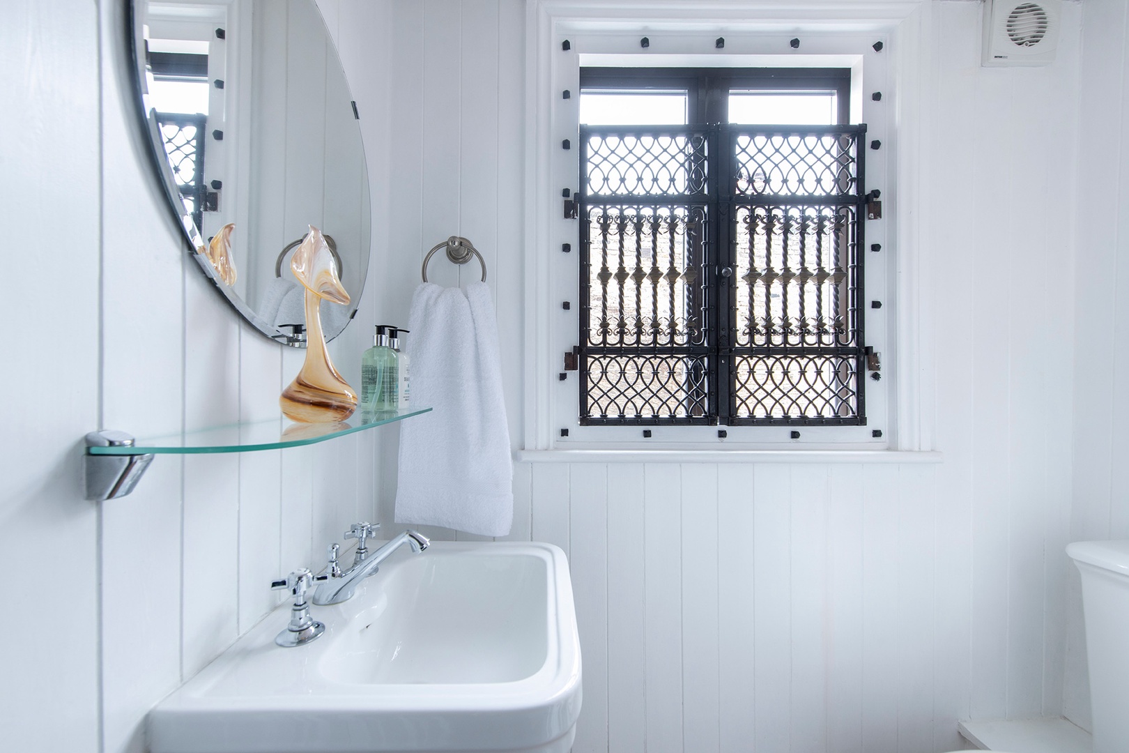 Bathroom with toilet is located on the landing between the living room and bedroom levels.