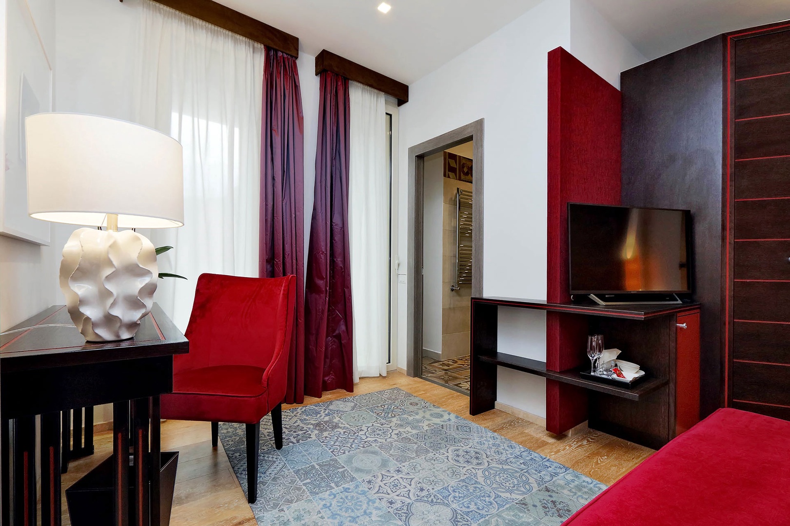 Doors open to balcony off of bedroom 1.
