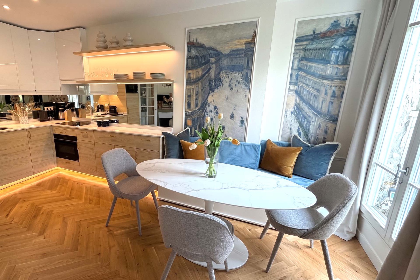 Dining table is set near the French doors to capture the view.
