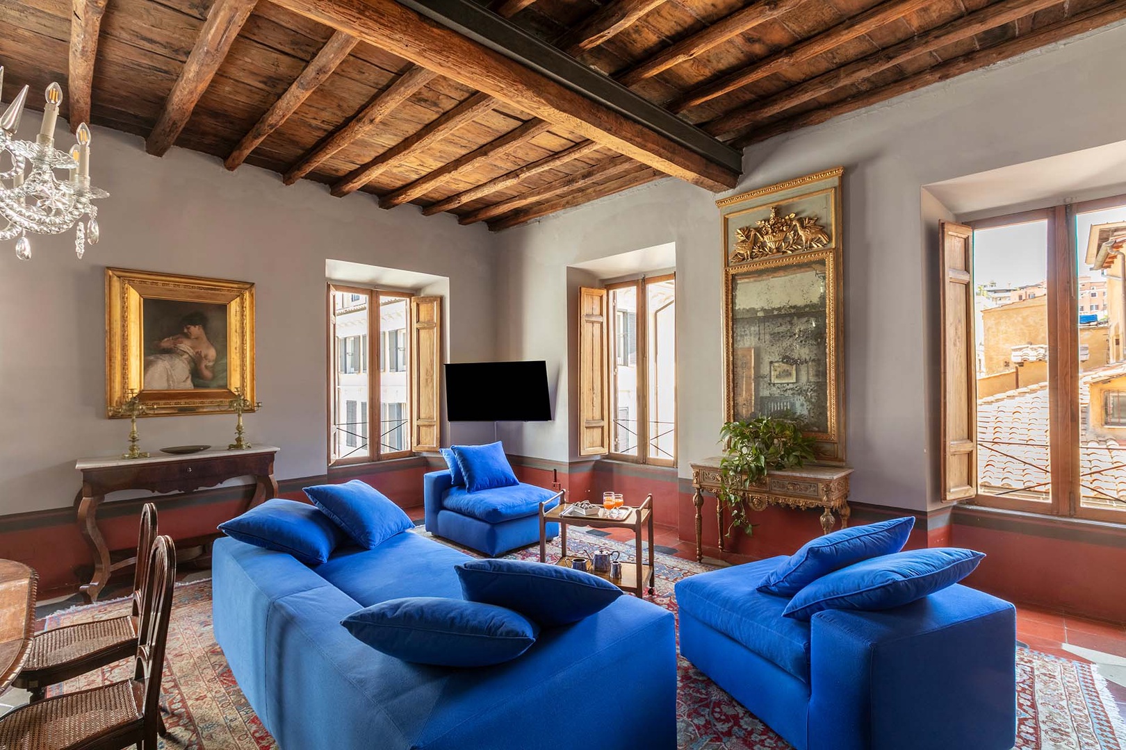 Stunning living room is full of light and historic design.