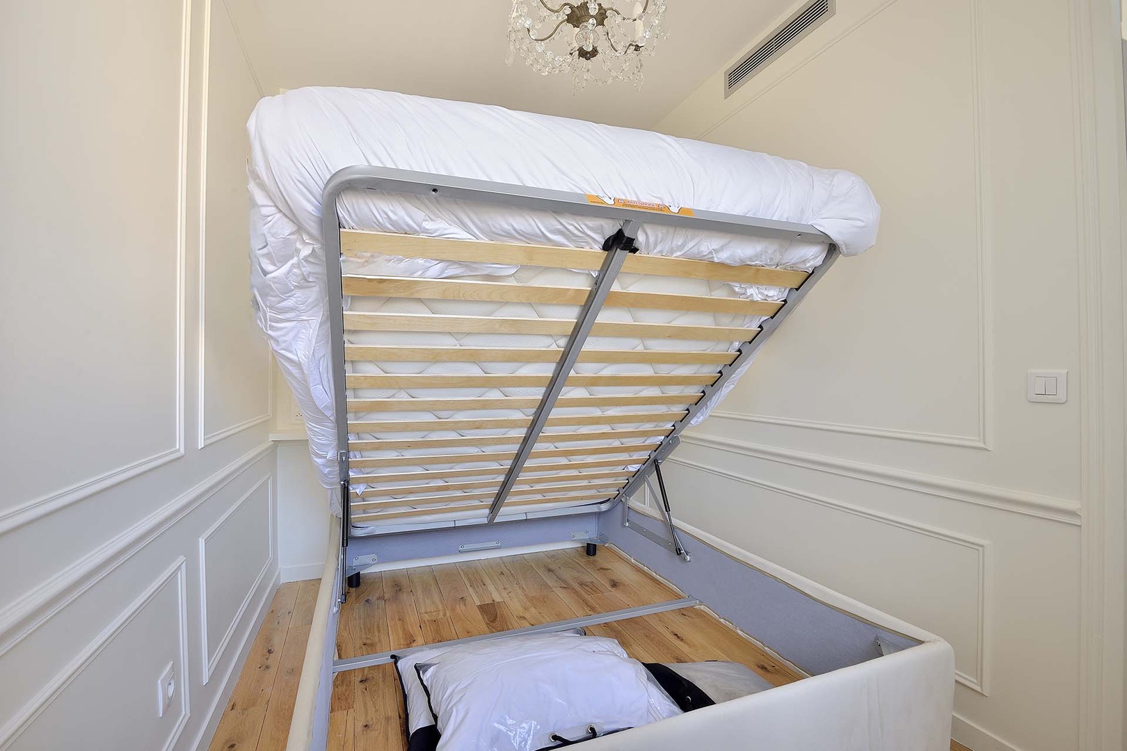 Clever below bed storage in the bedroom.