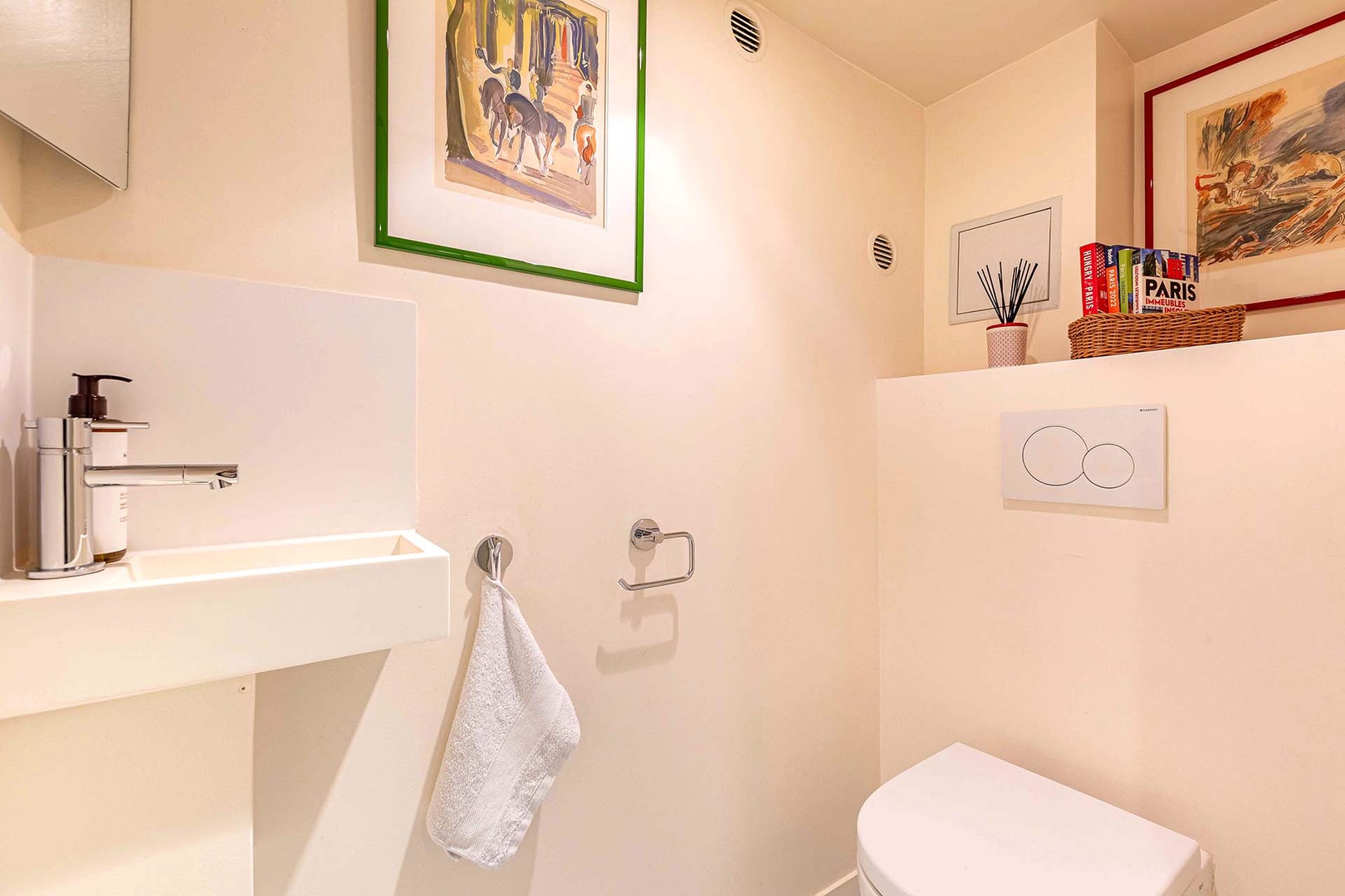 Powder room with toilet and sink.