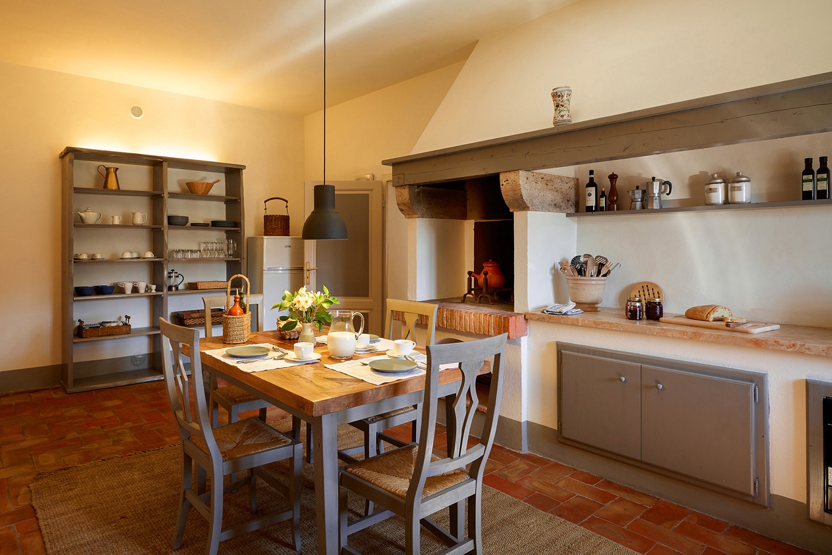 This country kitchen even has an old wood burning oven for character.