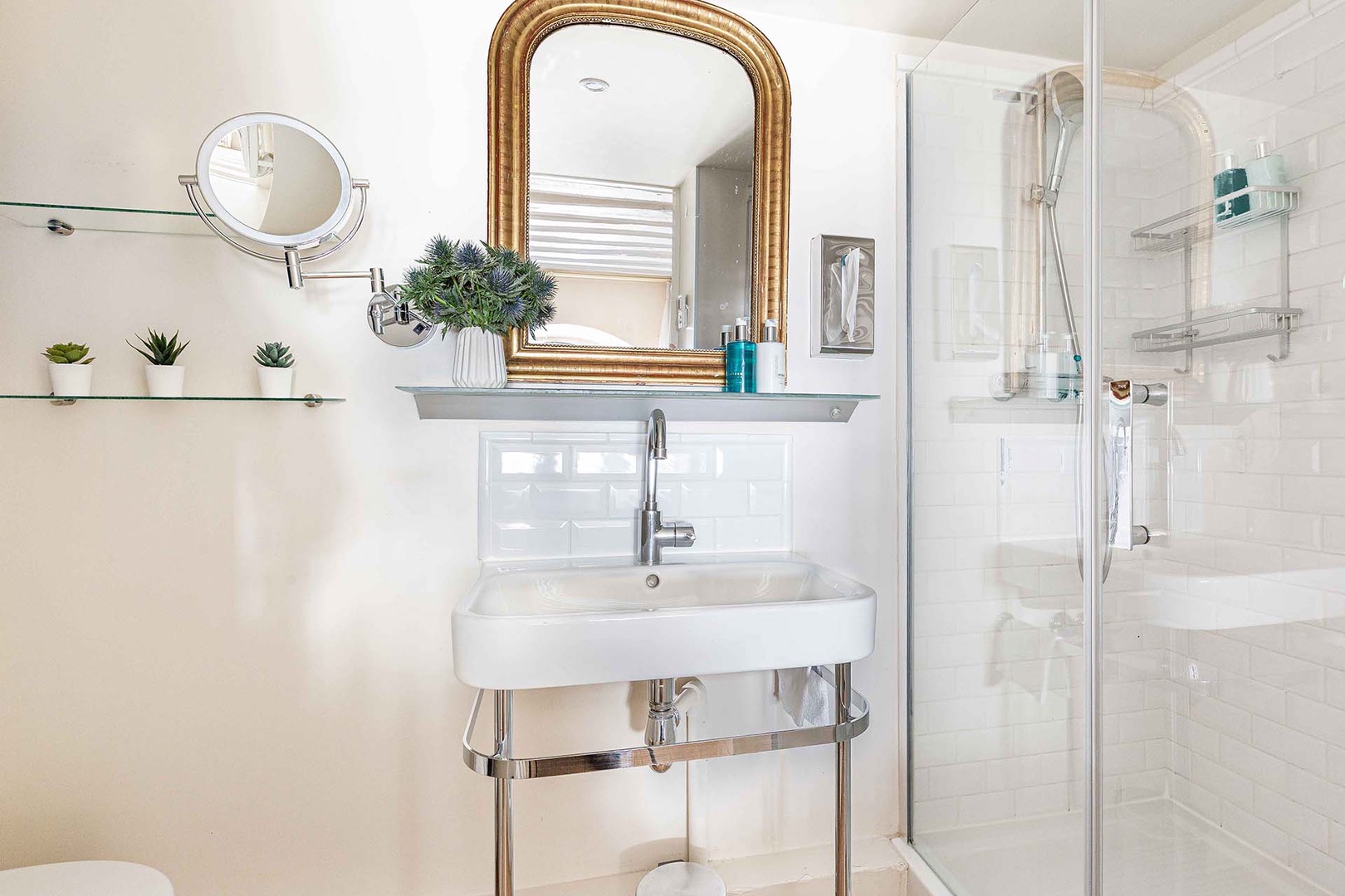 Bathroom 1 with a shower, toilet and sink.