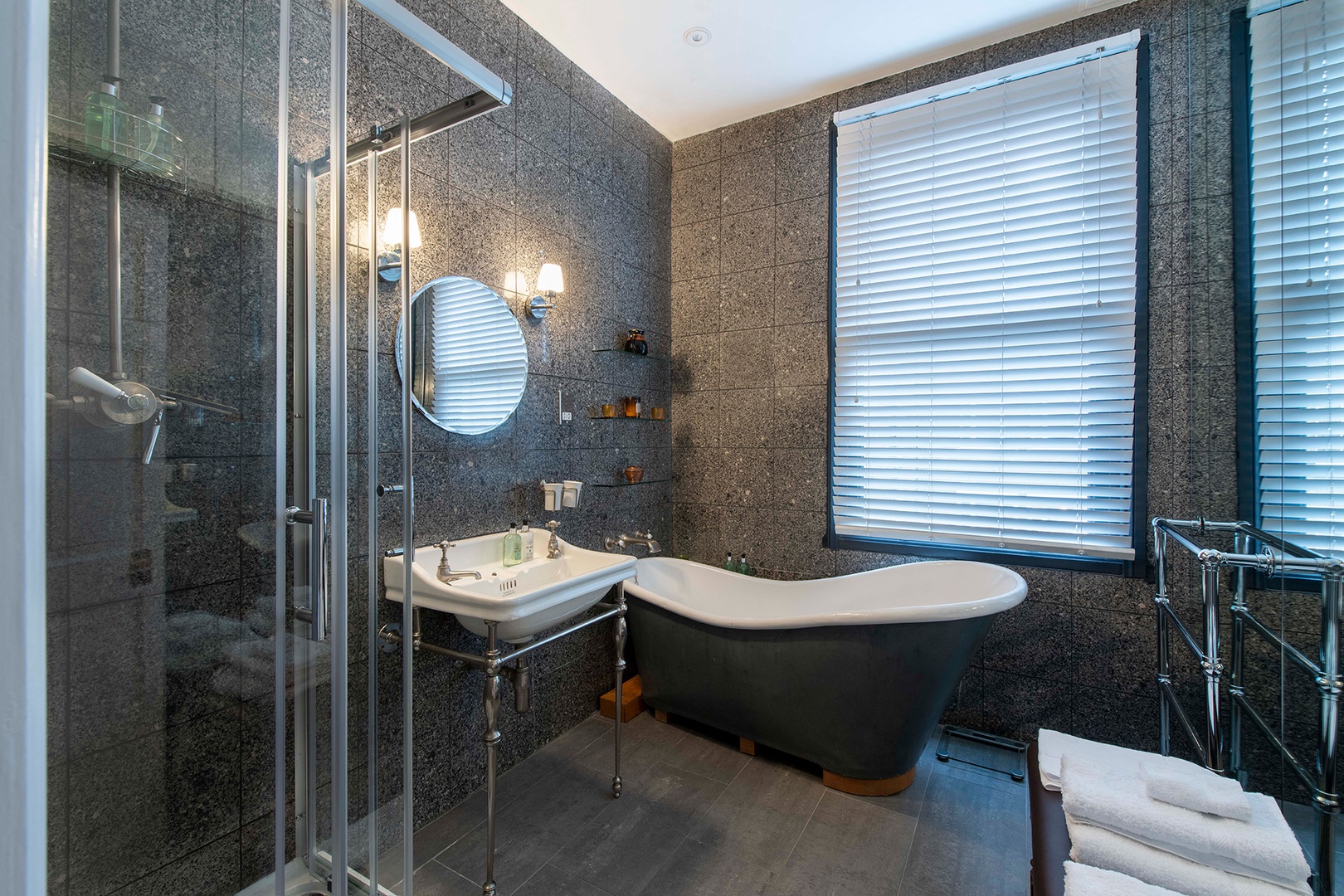 Bathroom with sink, shower and bathtub is on same level as bedrooms.