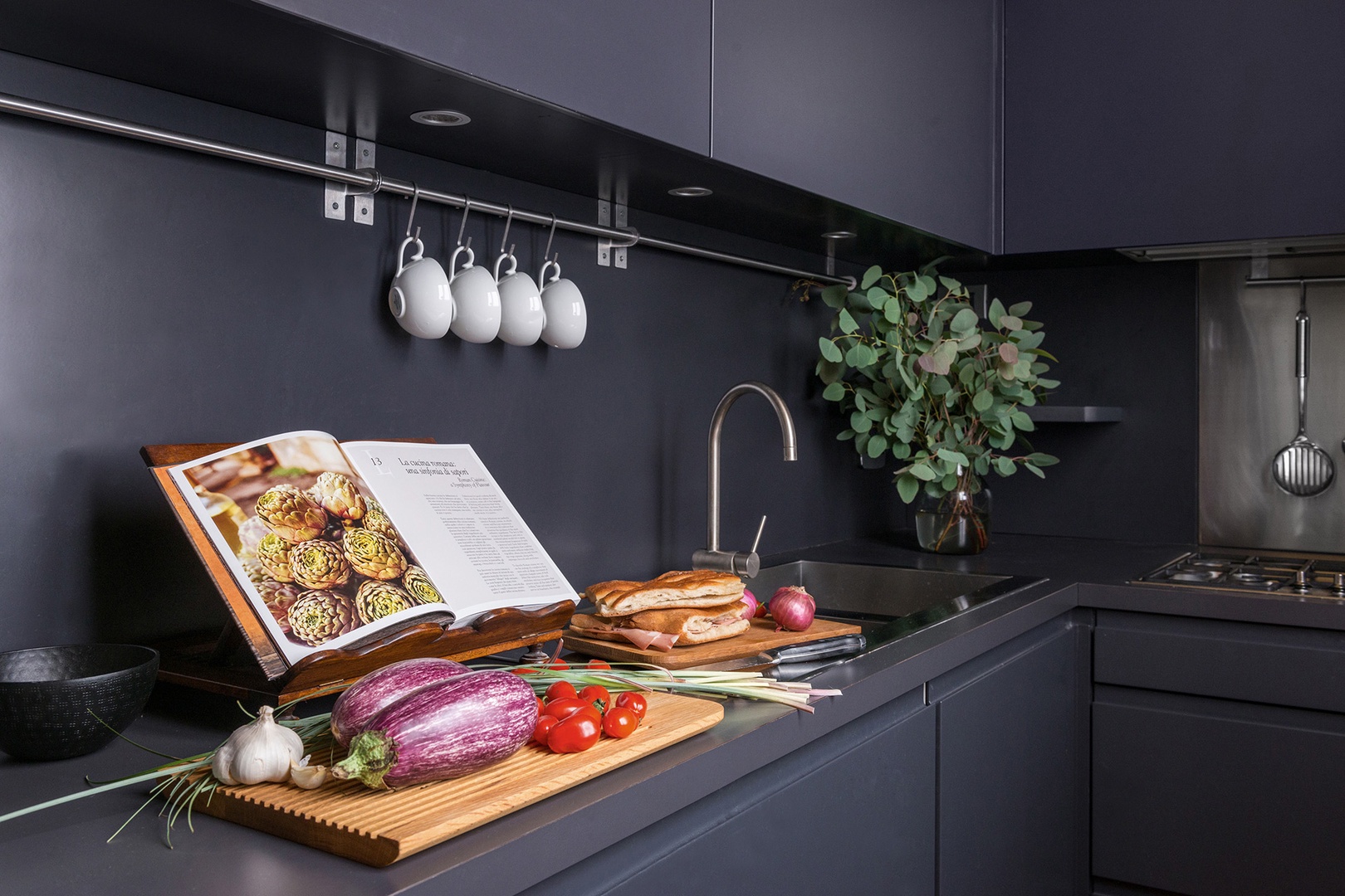 Sleek, modern kitchen. The refrigerator comes stocked with beverages and is restocked daily.