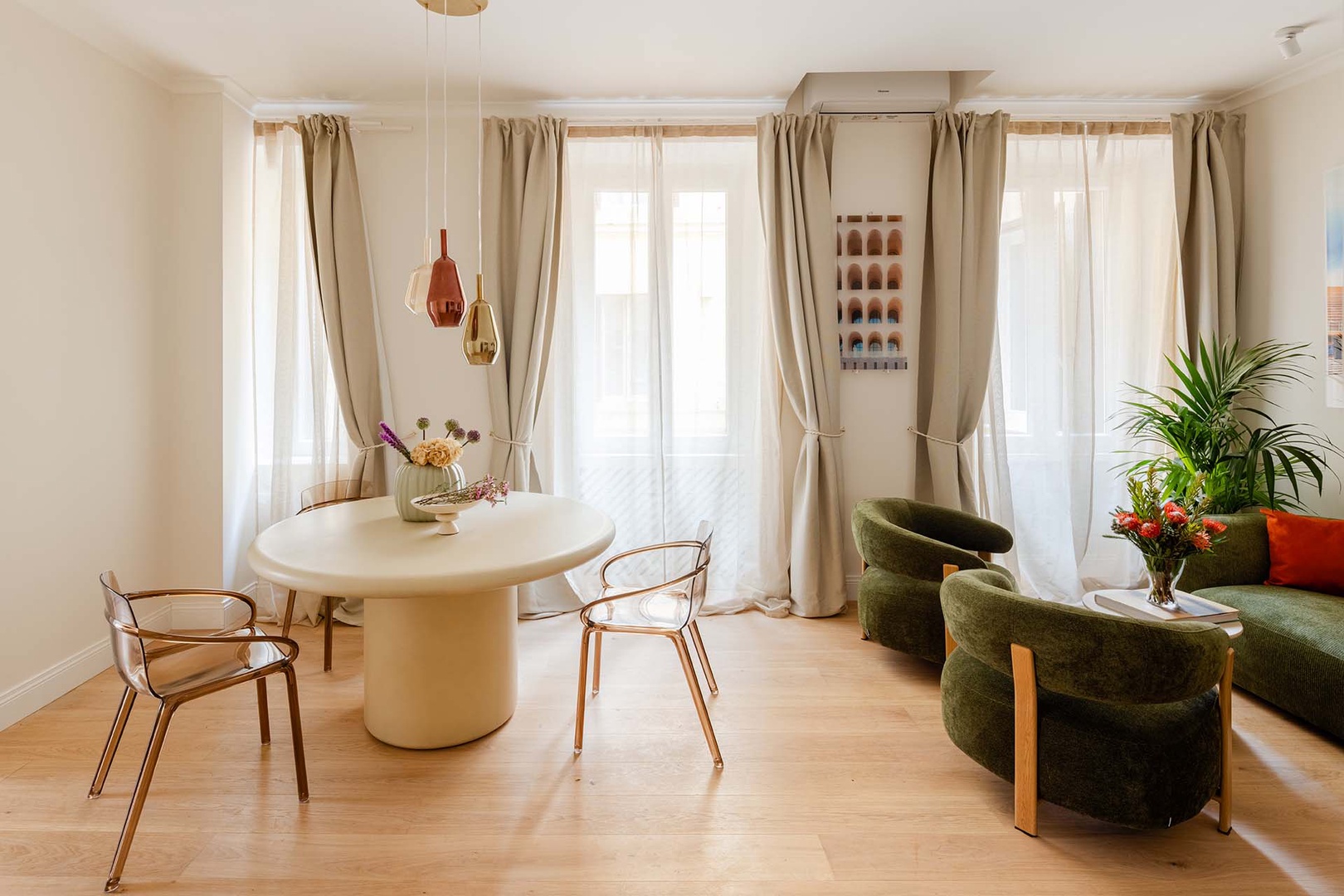 Dine at home in style with chic table and modern light fixture.