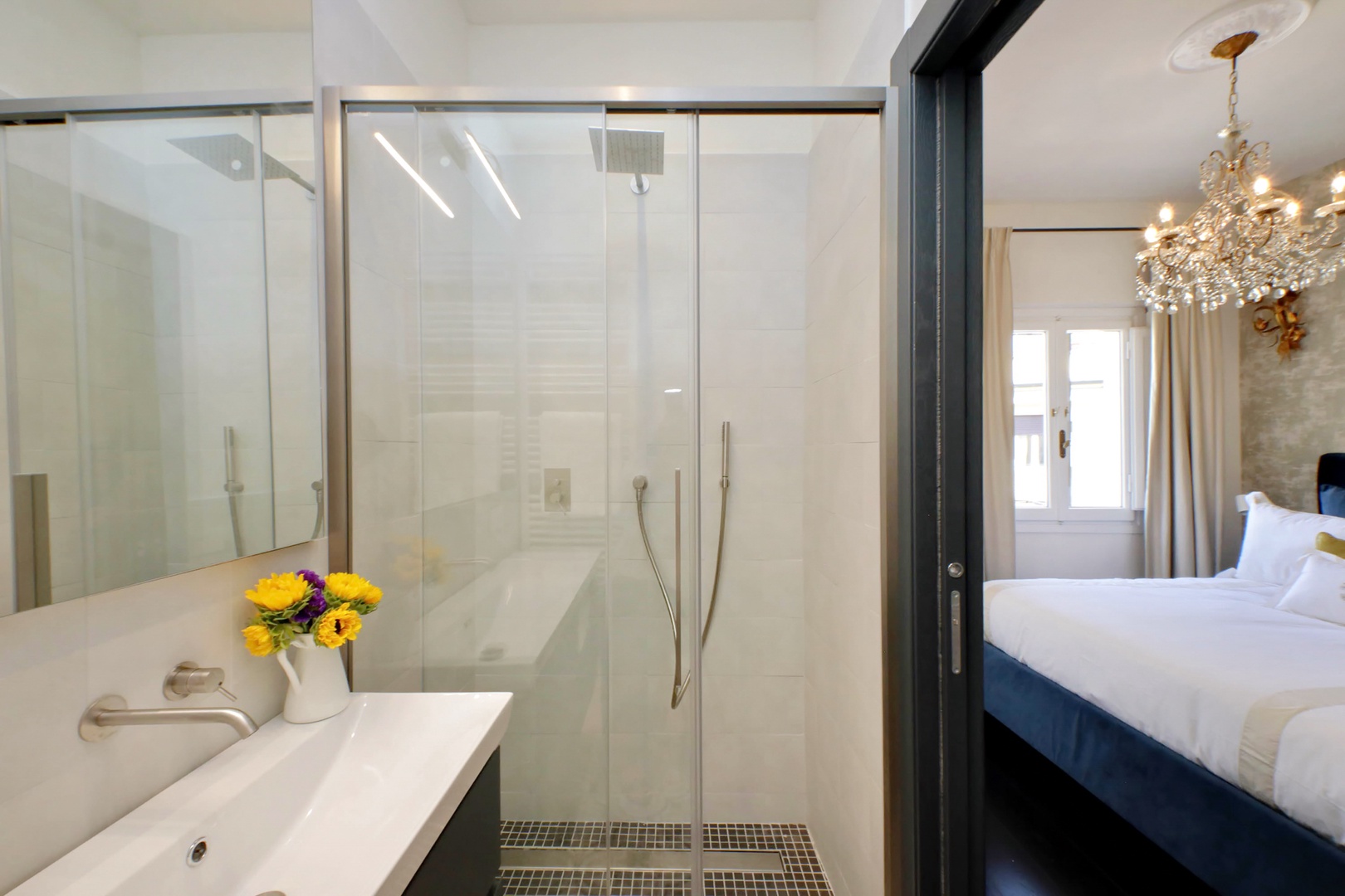 Bathroom 1 is en suite with a large shower