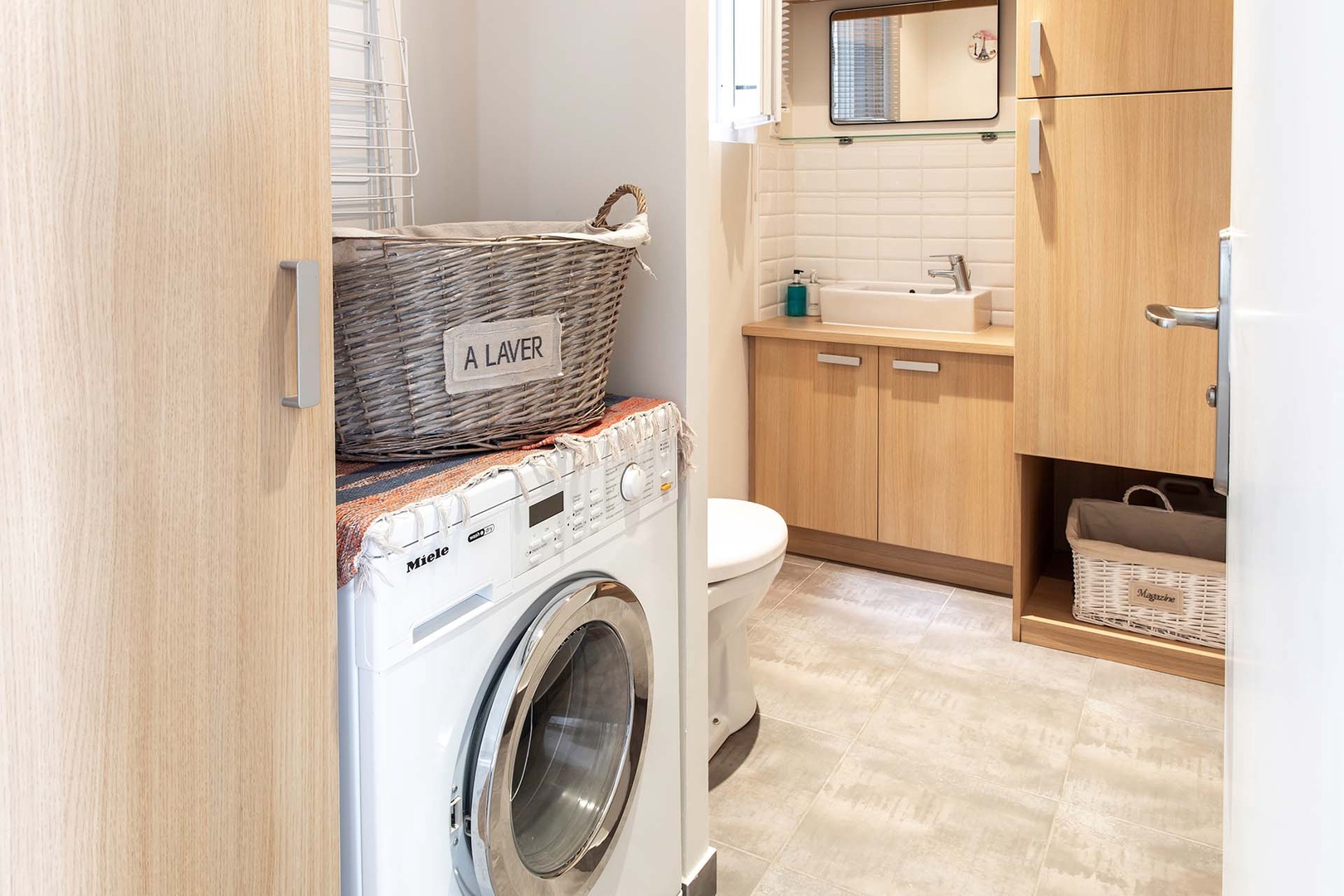 A washer/ dryer combo locatedin half bathroom.