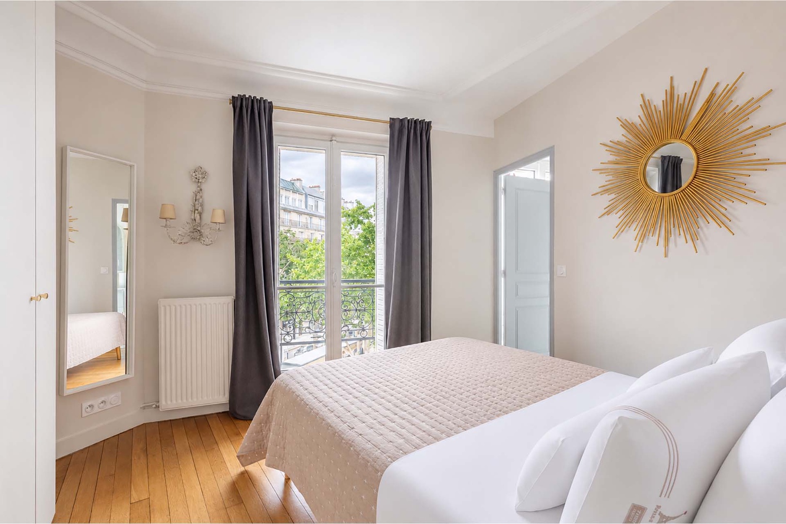Wake up and look out to Eiffel Tower views from the bedroom.