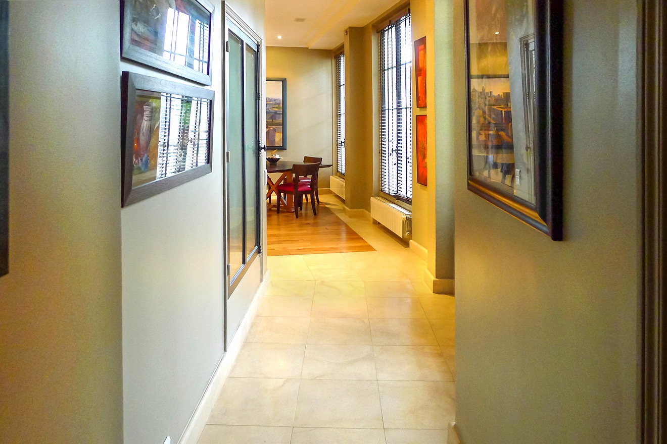 Hallway leading toward the dining room and kitchen