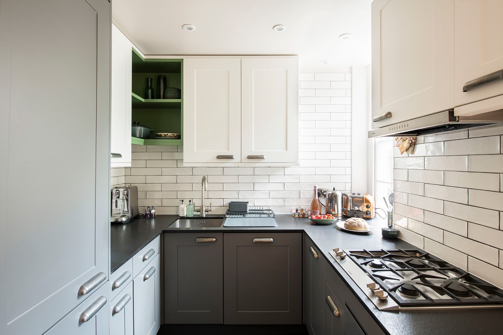 Gorgeous kitchen with window overlooking terrace.