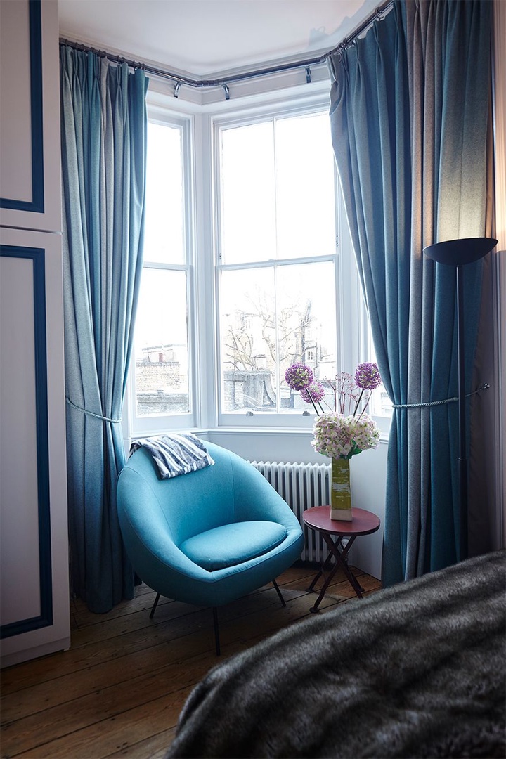 This stylish chair in the window is perfect for tea and a good book