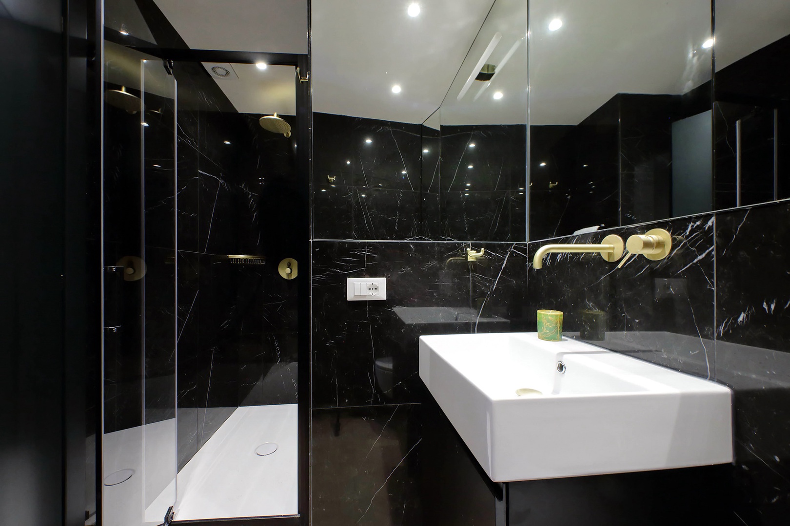 The black tile gives a sense of opulence to bathroom 2.