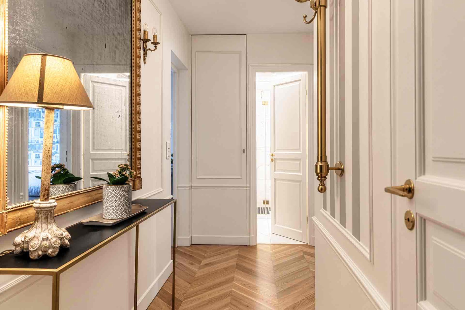 Elegant entrance with bedrooms on the right and living area on the left.