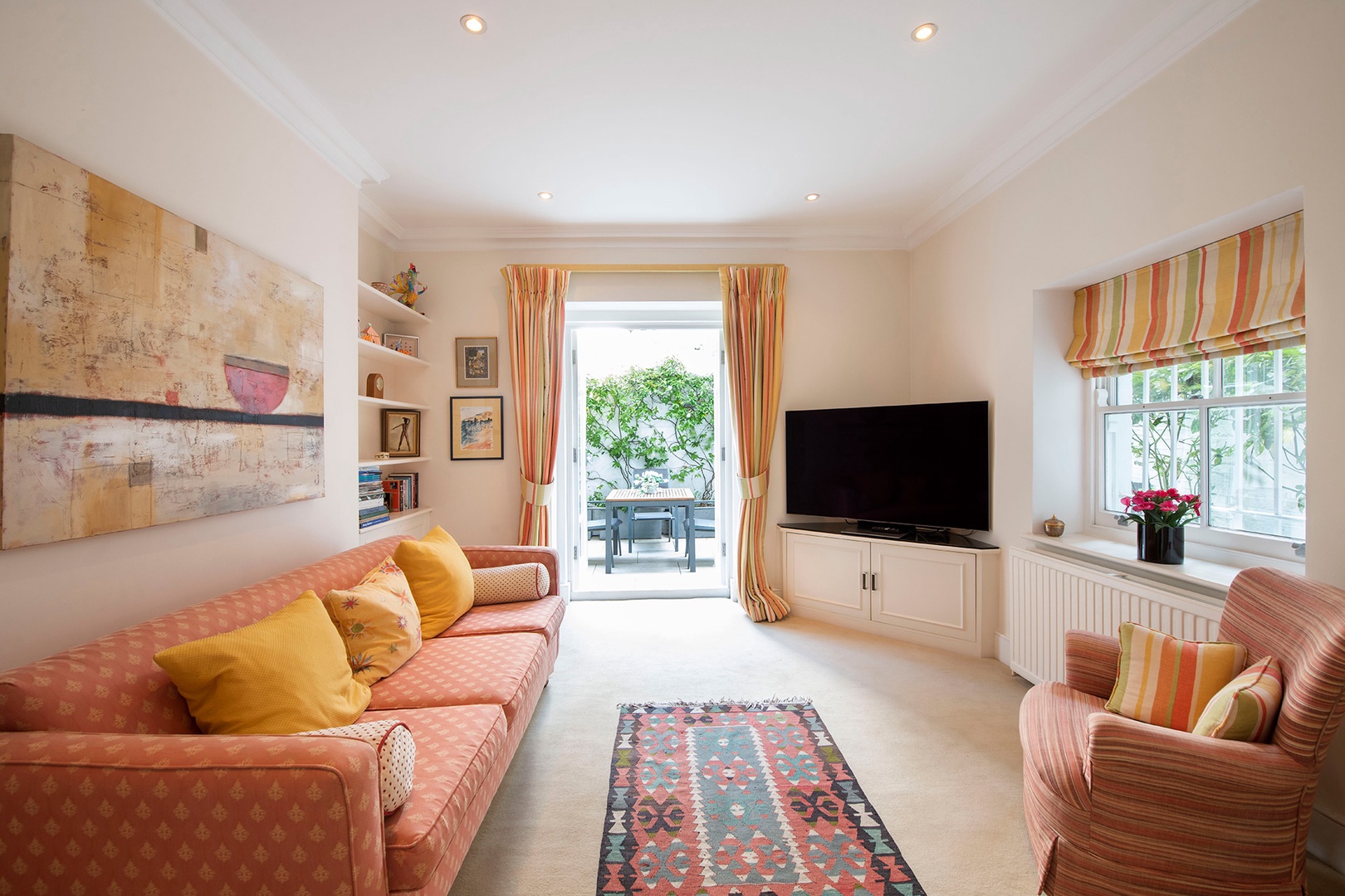 Large TV and sitting area in the den