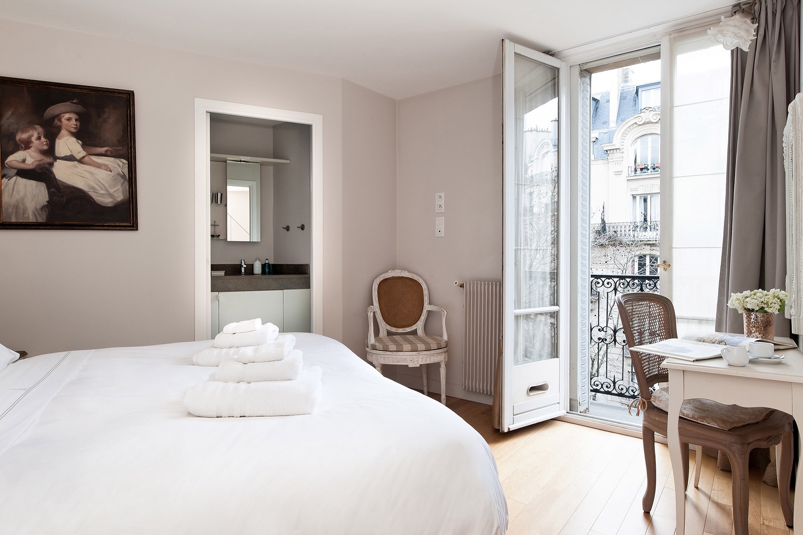 Bedroom 1 has an en suite bathroom, balcony and Eiffel Tower views!