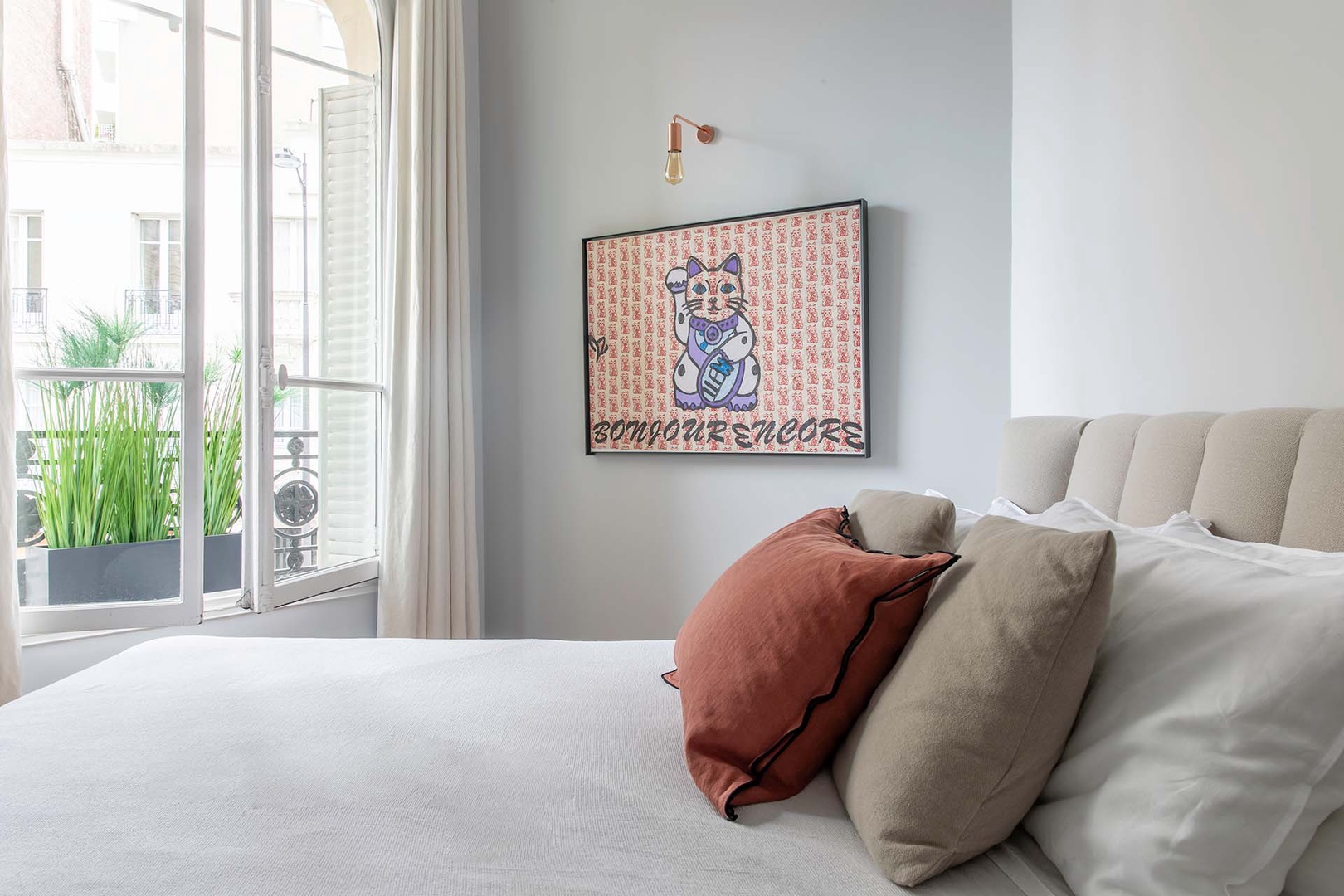 Soft beige decorative touches in bedroom 2.