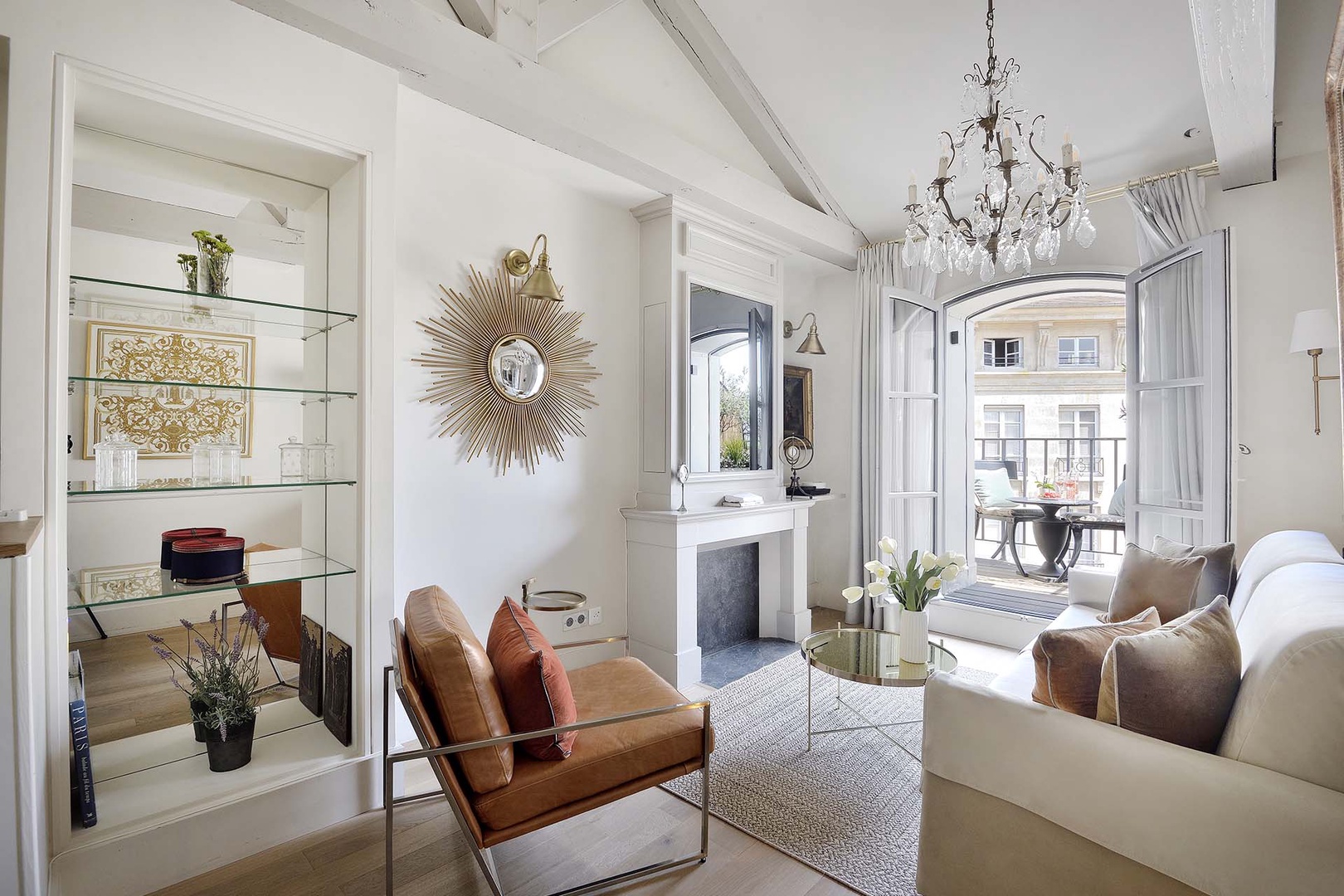 The large French window lets in lots of natural light at the beautiful Monbazillac apartment.