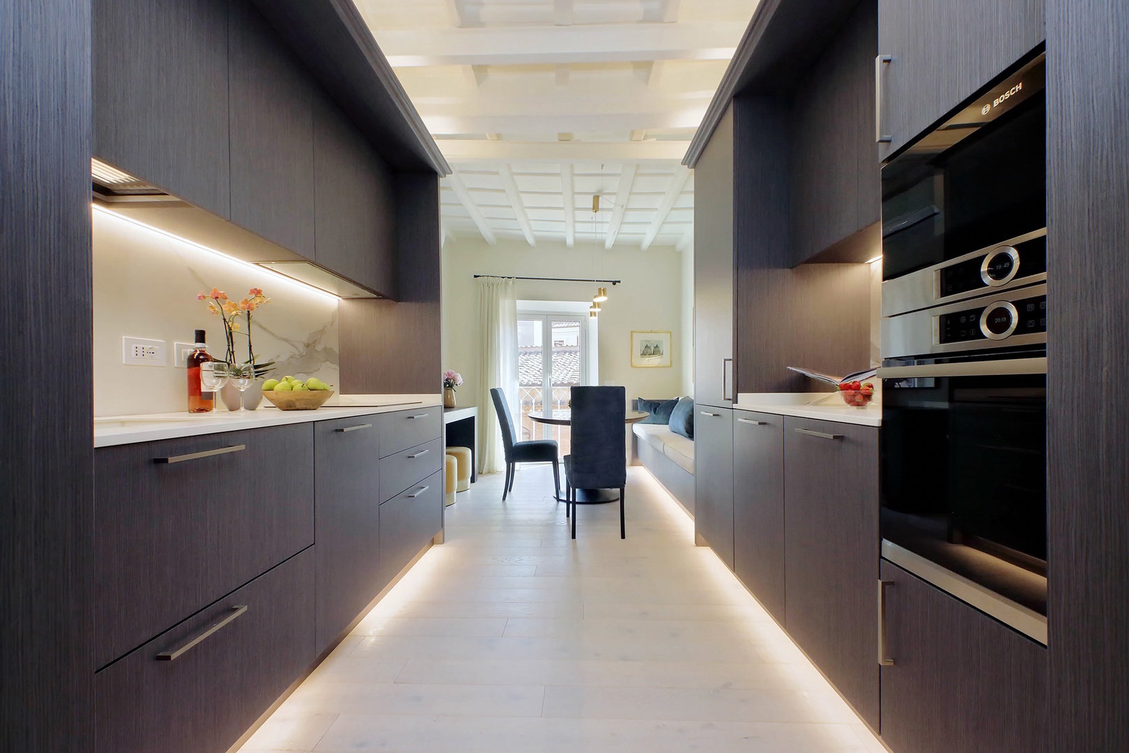 Fully equipped kitchen has a sleek and modern design.