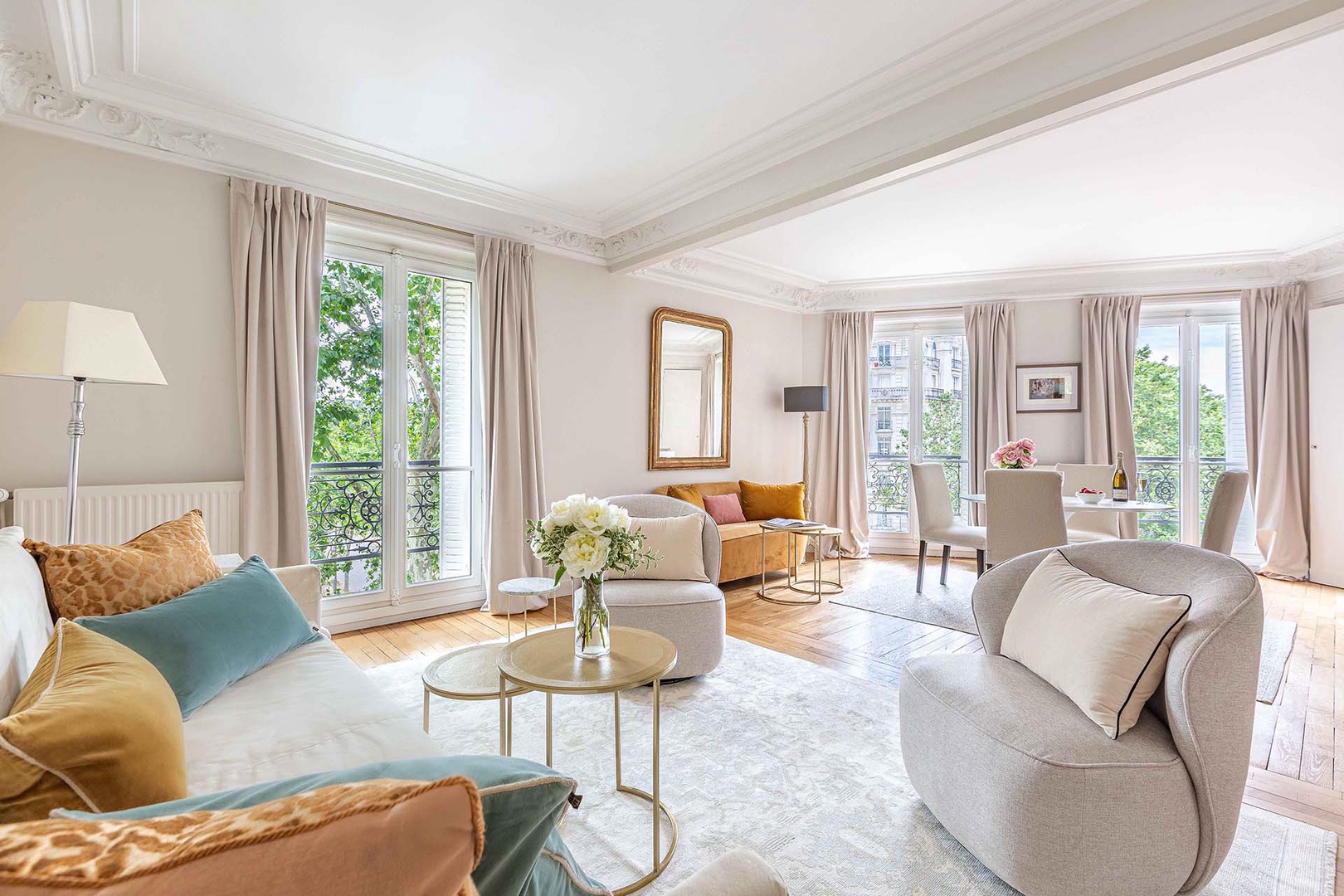 Spacious double living room with views of tree-lined boulevard.
