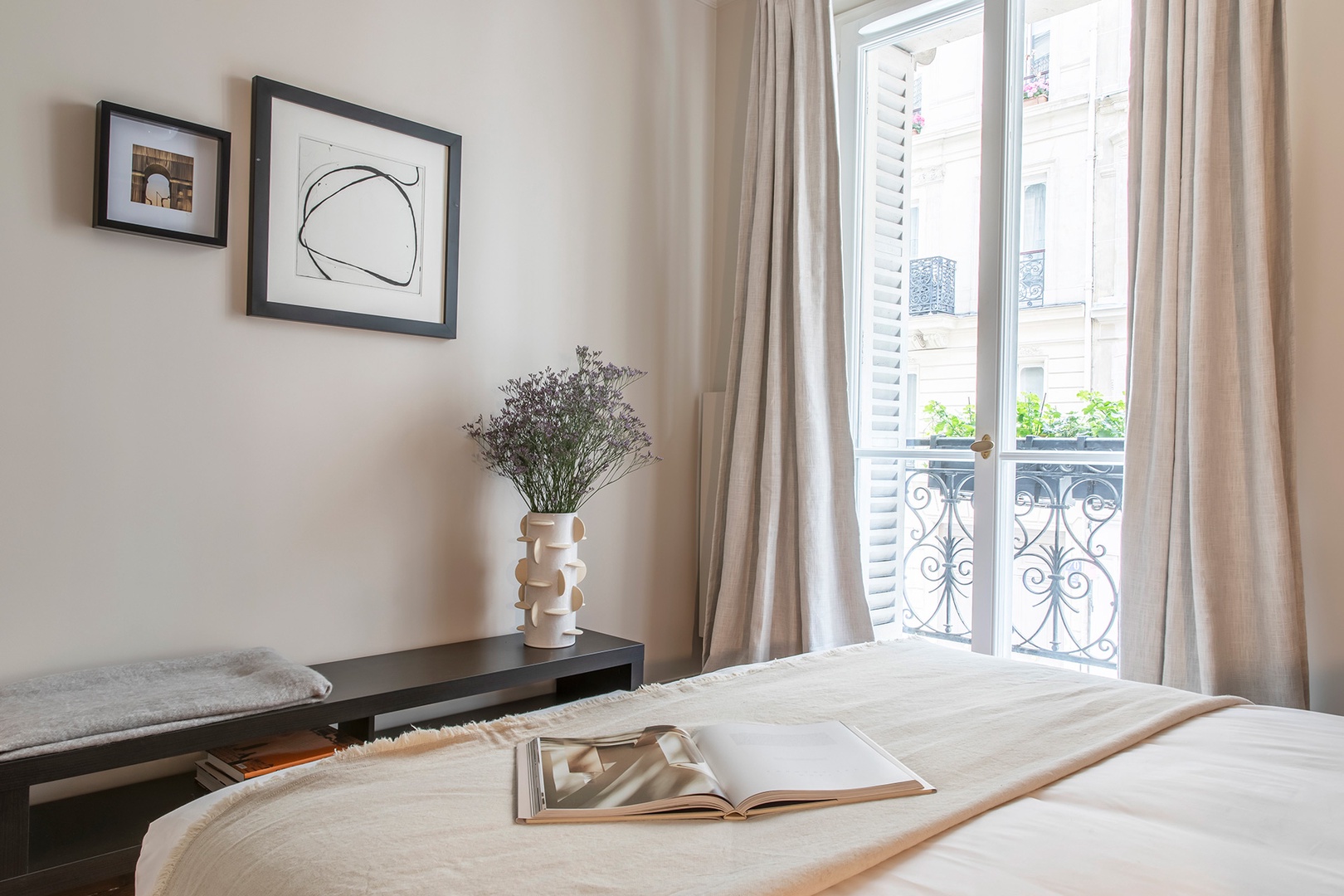Relax in bed and enjoy a view of classic Parisian architecture.