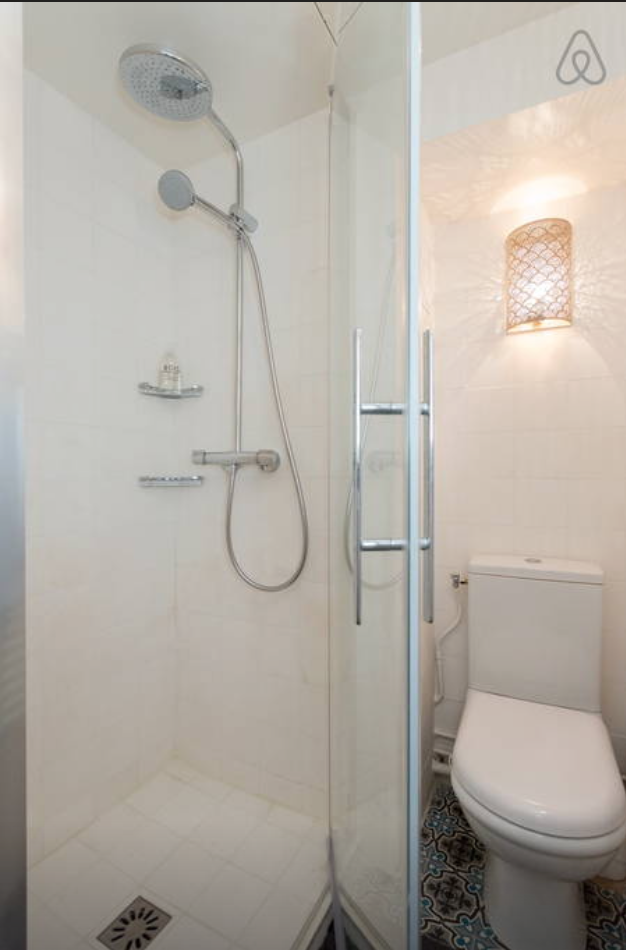 Bathroom with step in shower.
