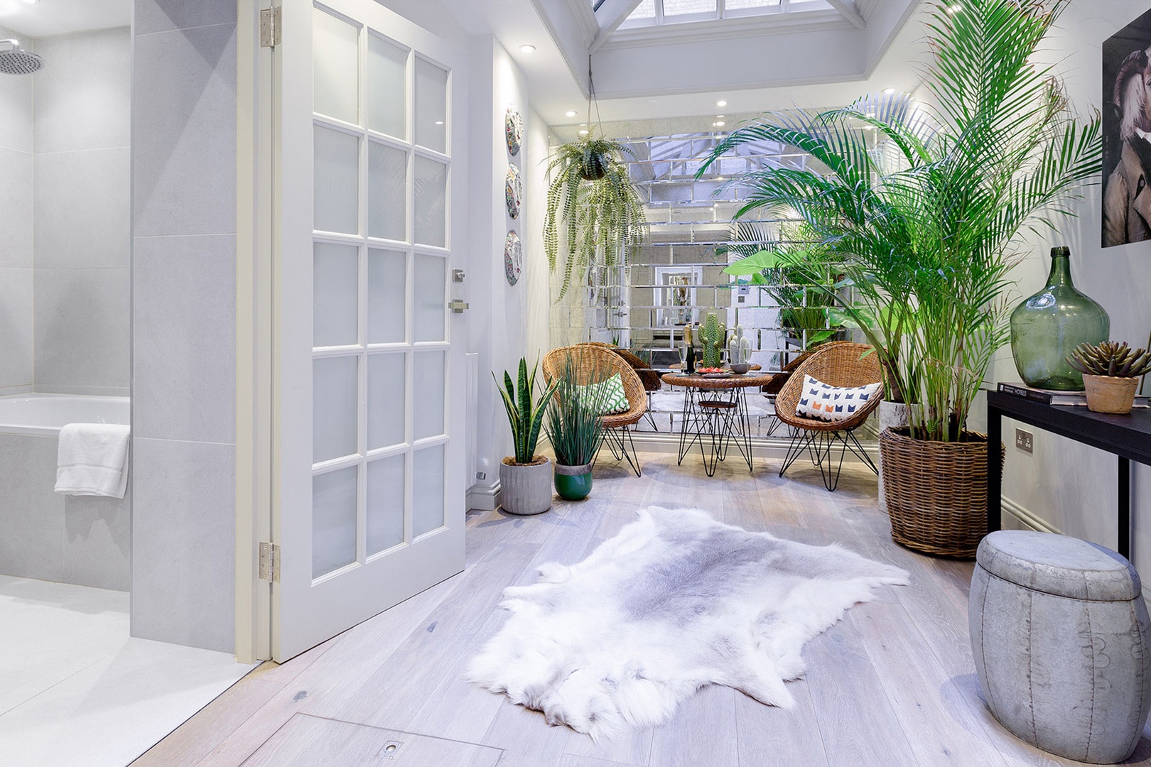 Light streams into the glass-domed sunroom.