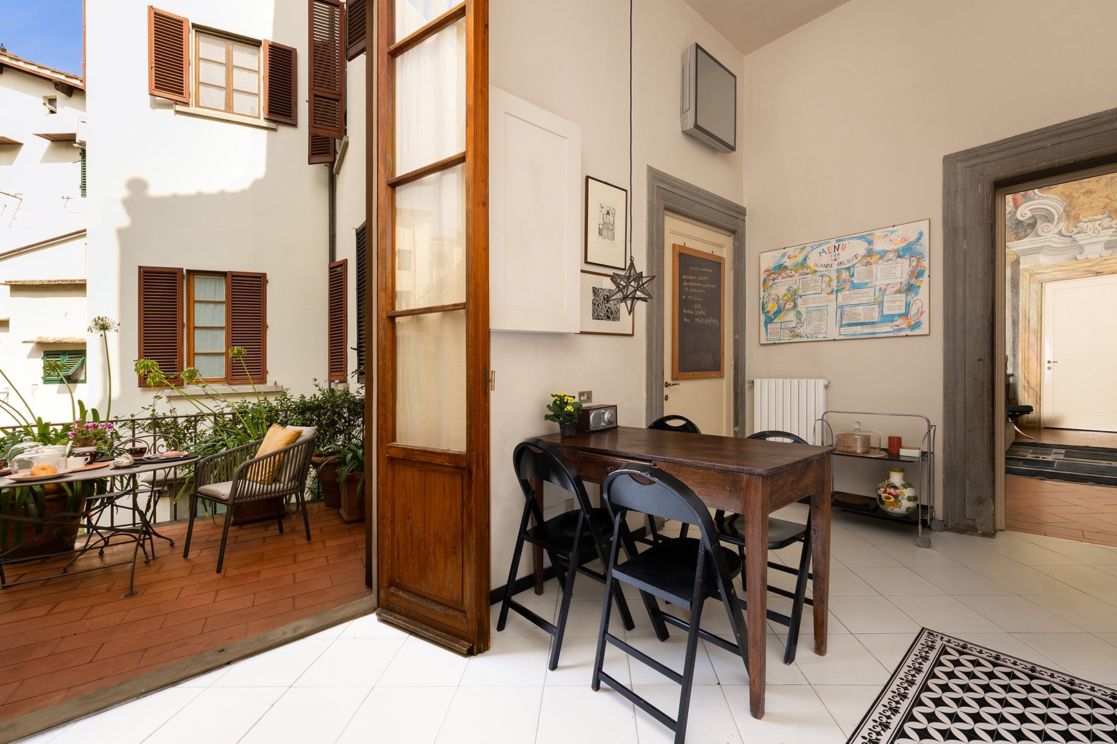 Terrace leads into kitchen.