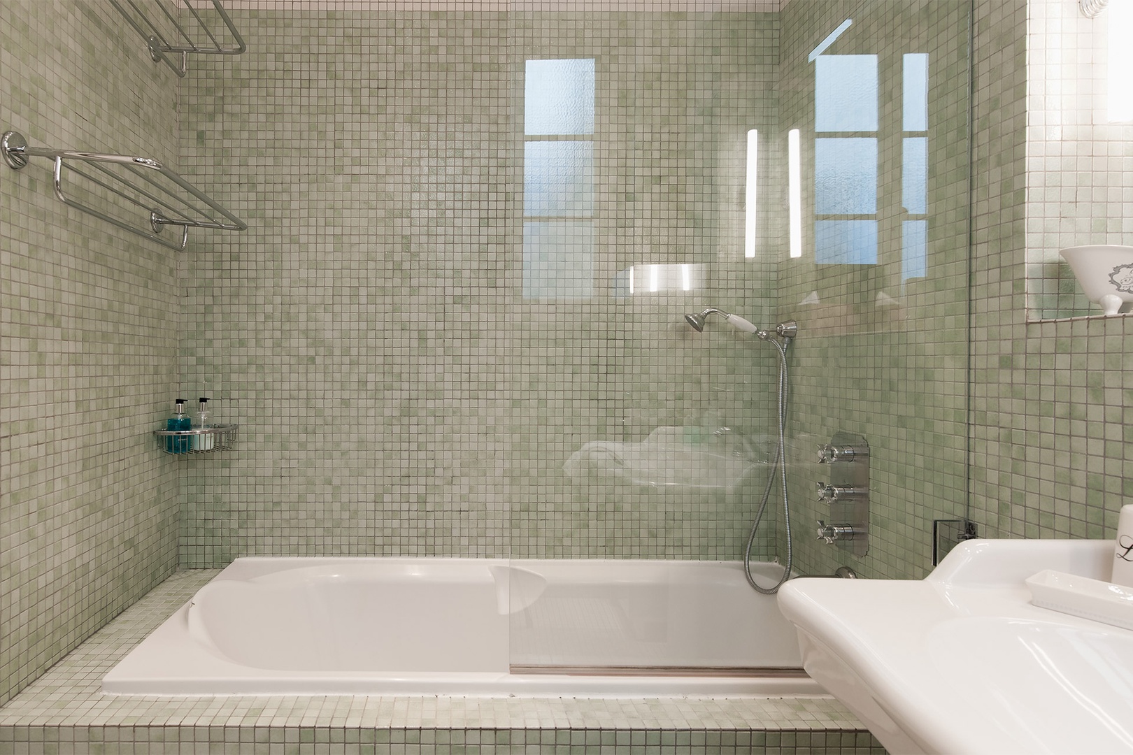 Take a relaxing bath surrounded by glistening tiles.
