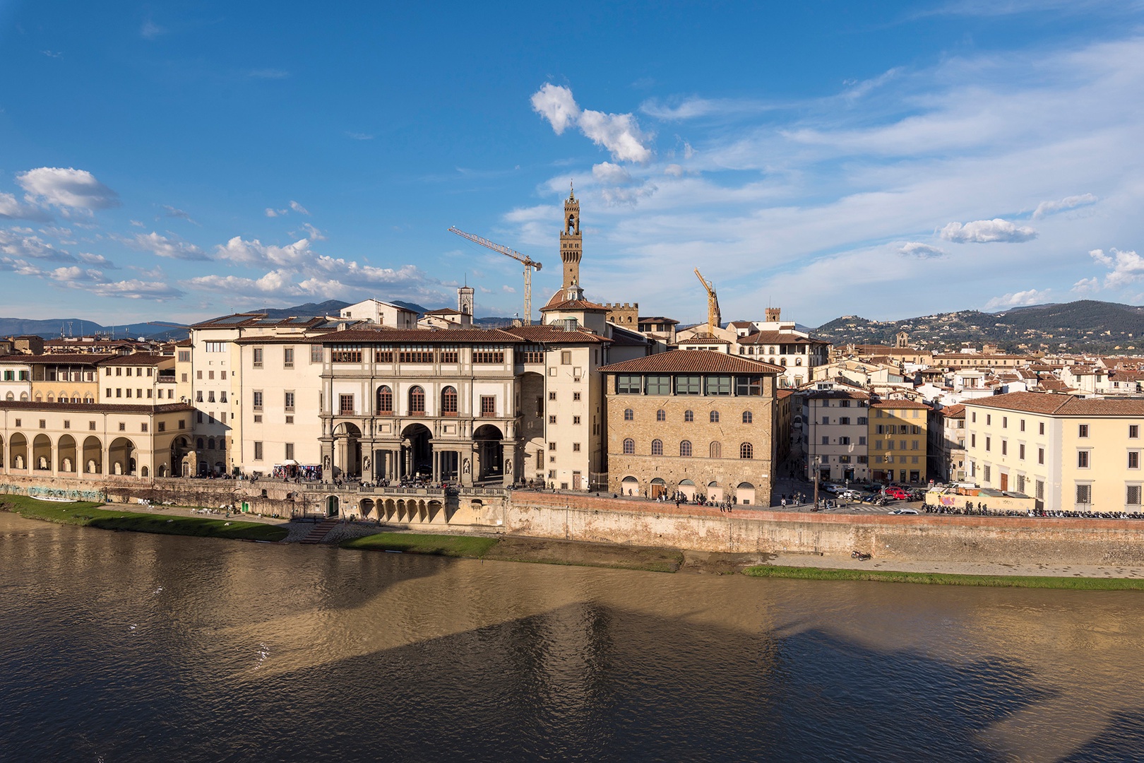 Admire the beautiful Renaissance facade of the Uffizi across the river.