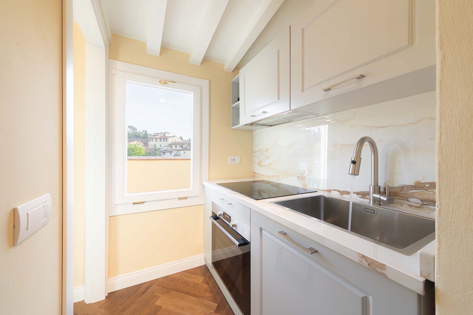 The kitchen is small yet well-designed for preparing meals.