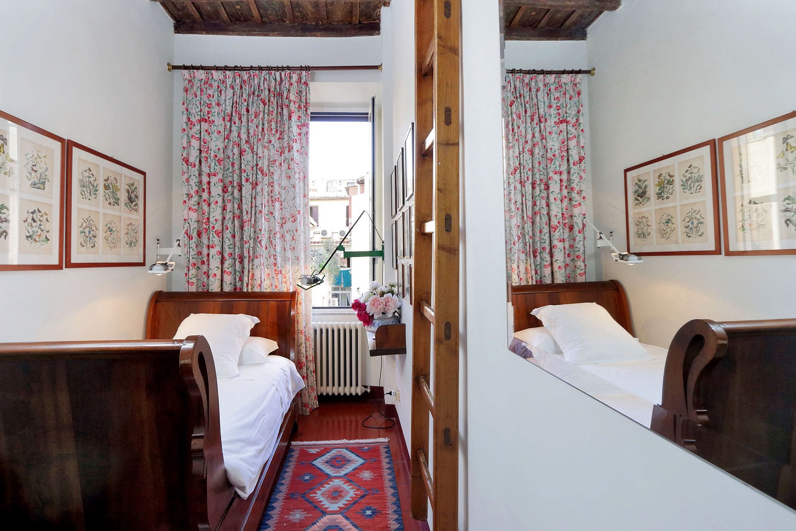 Bedroom 3 has a single bed plus a lofted bed above. This bedroom overlooks the inner courtyard.