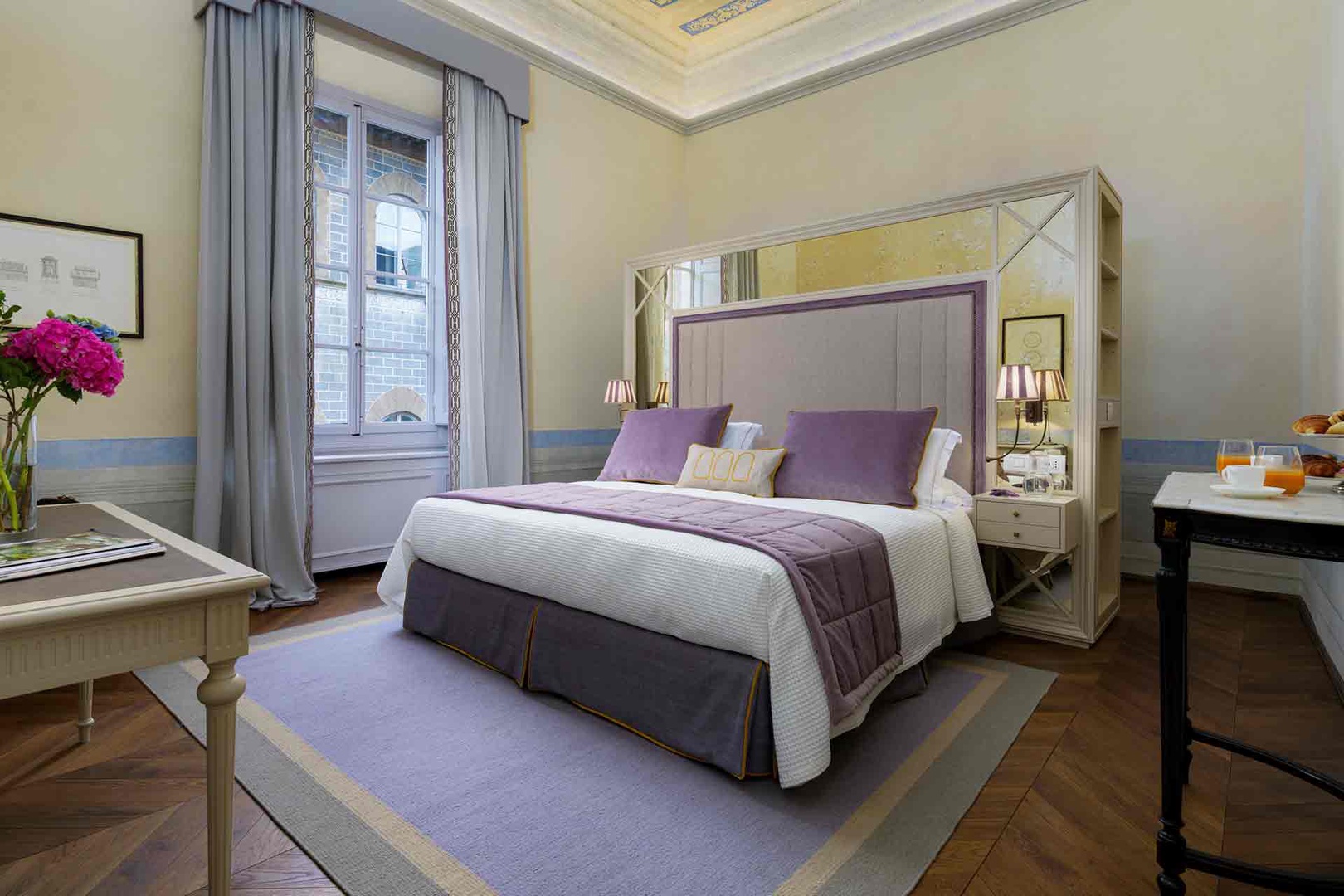 Spacious bedroom 1 with large window.