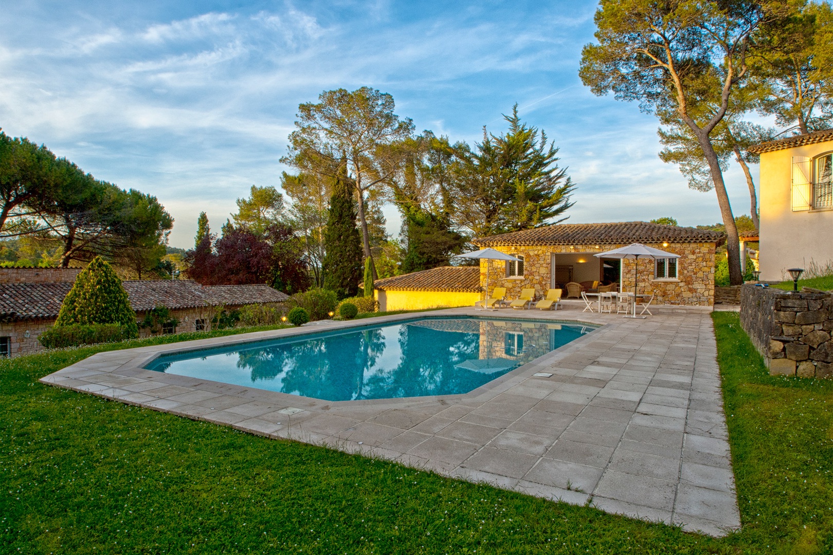 Large pool house with living area, kitchen, shower and powder room