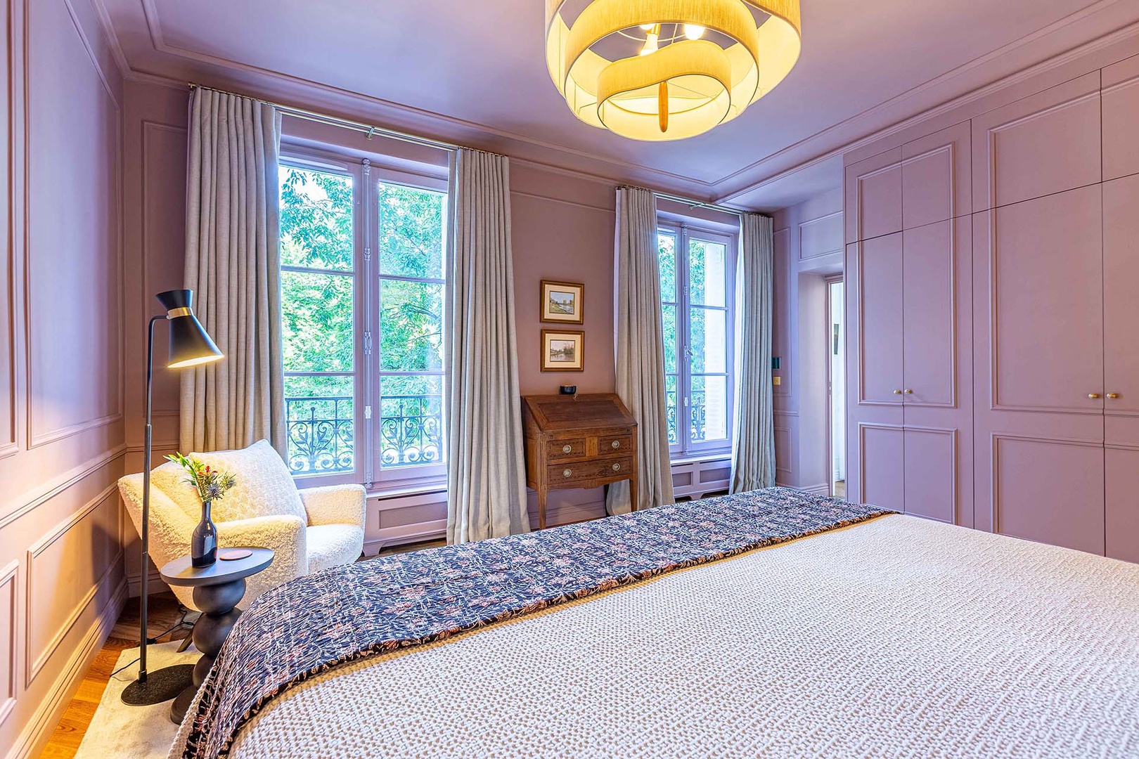 Two large French windows in the bedroom.