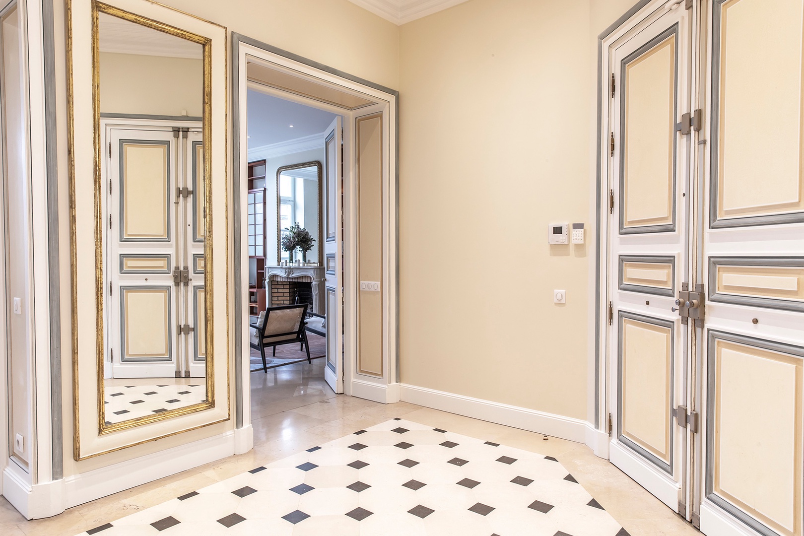 Elegant marble lined entryway welcomes you home.