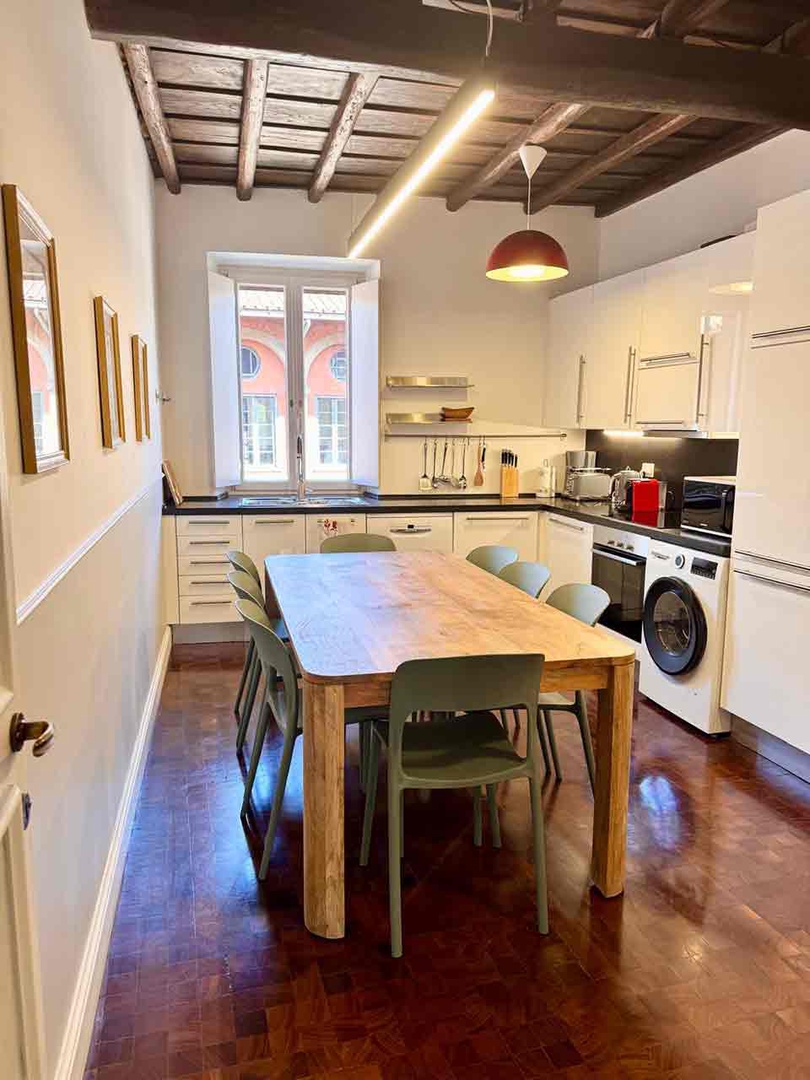 Fully equipped kitchen with dining table.